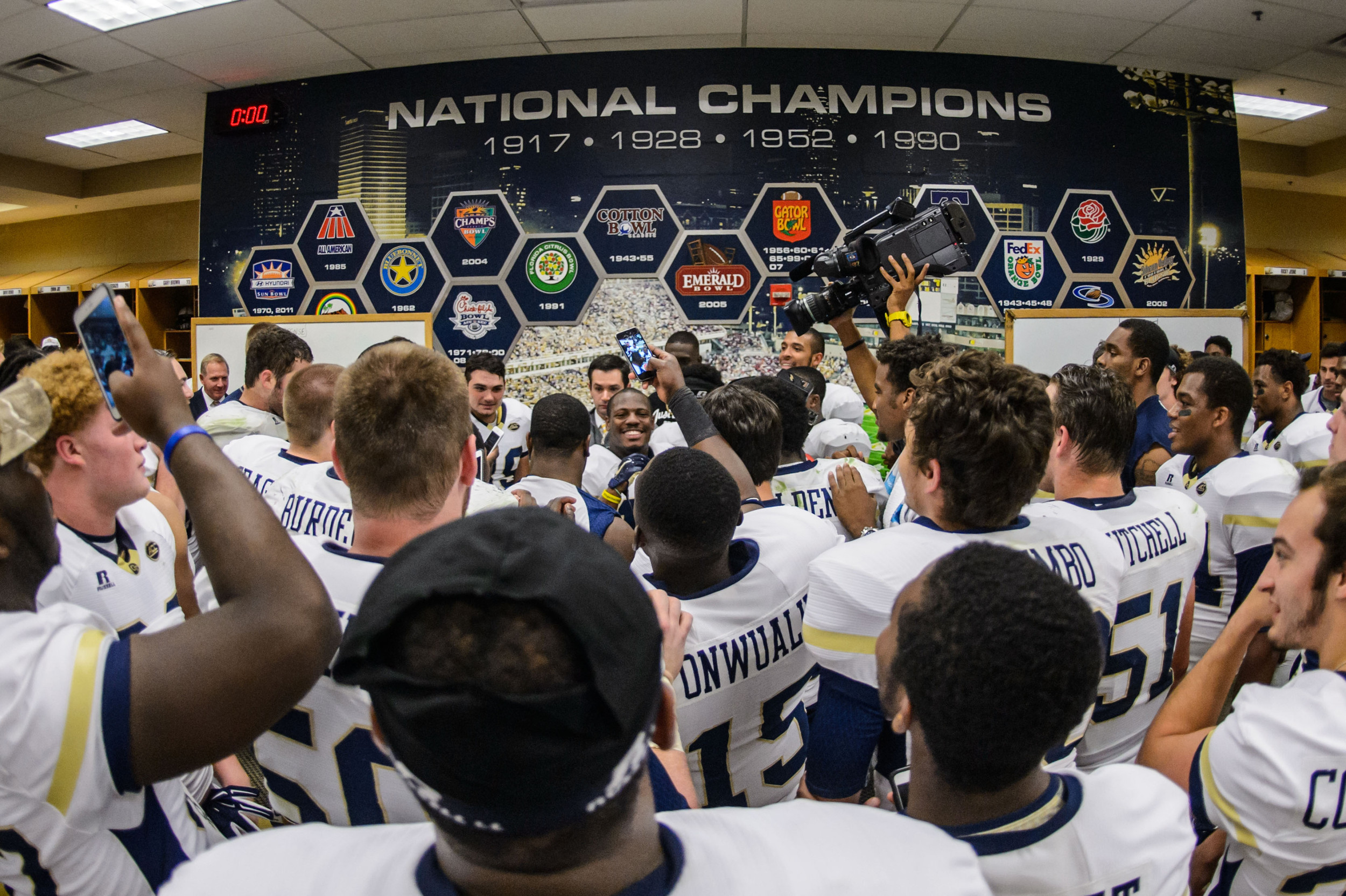 Coach Paul Johnson talks to the team after the upset victory