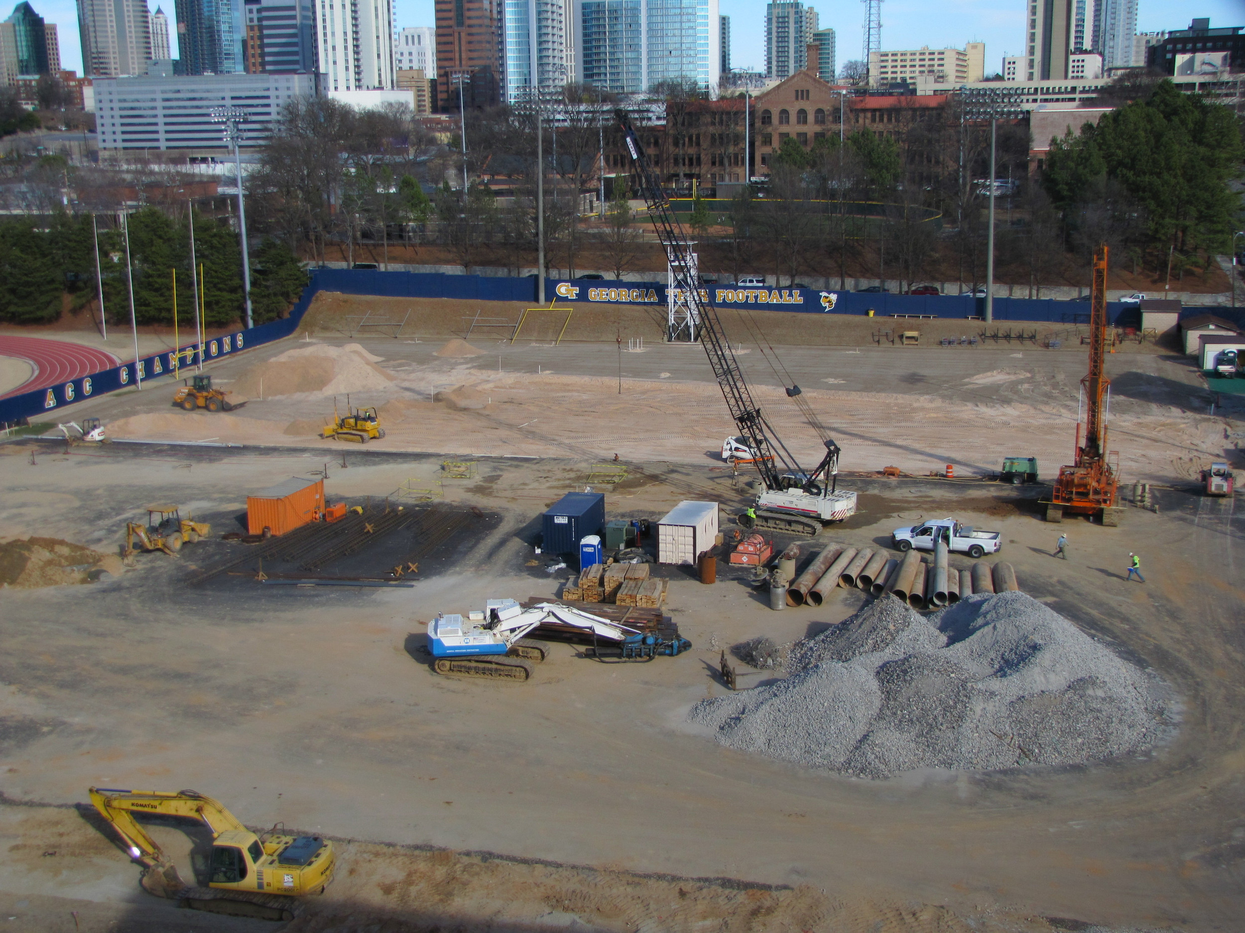 Week 7 - Photo taken on Feb. 15, 2011 - Barton Malow has taken down a light pole, has cleared more dirt from around the edge of the foot print and is finishing up drilling holes for foundation.