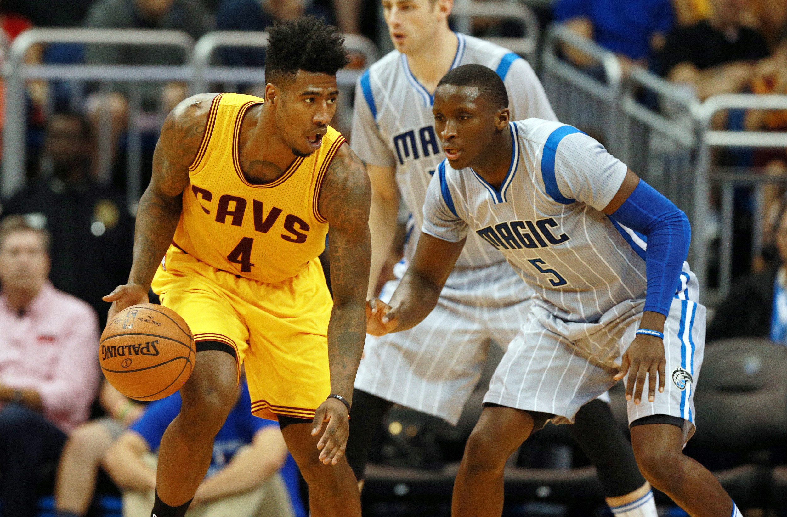 Mar 18, 2016; Orlando, FL, USA; Cleveland Cavaliers guard Iman Shumpert (4) drives to the basket against Orlando Magic guard Victor Oladipo (5). Credit: Kim Klement-USA TODAY Sports