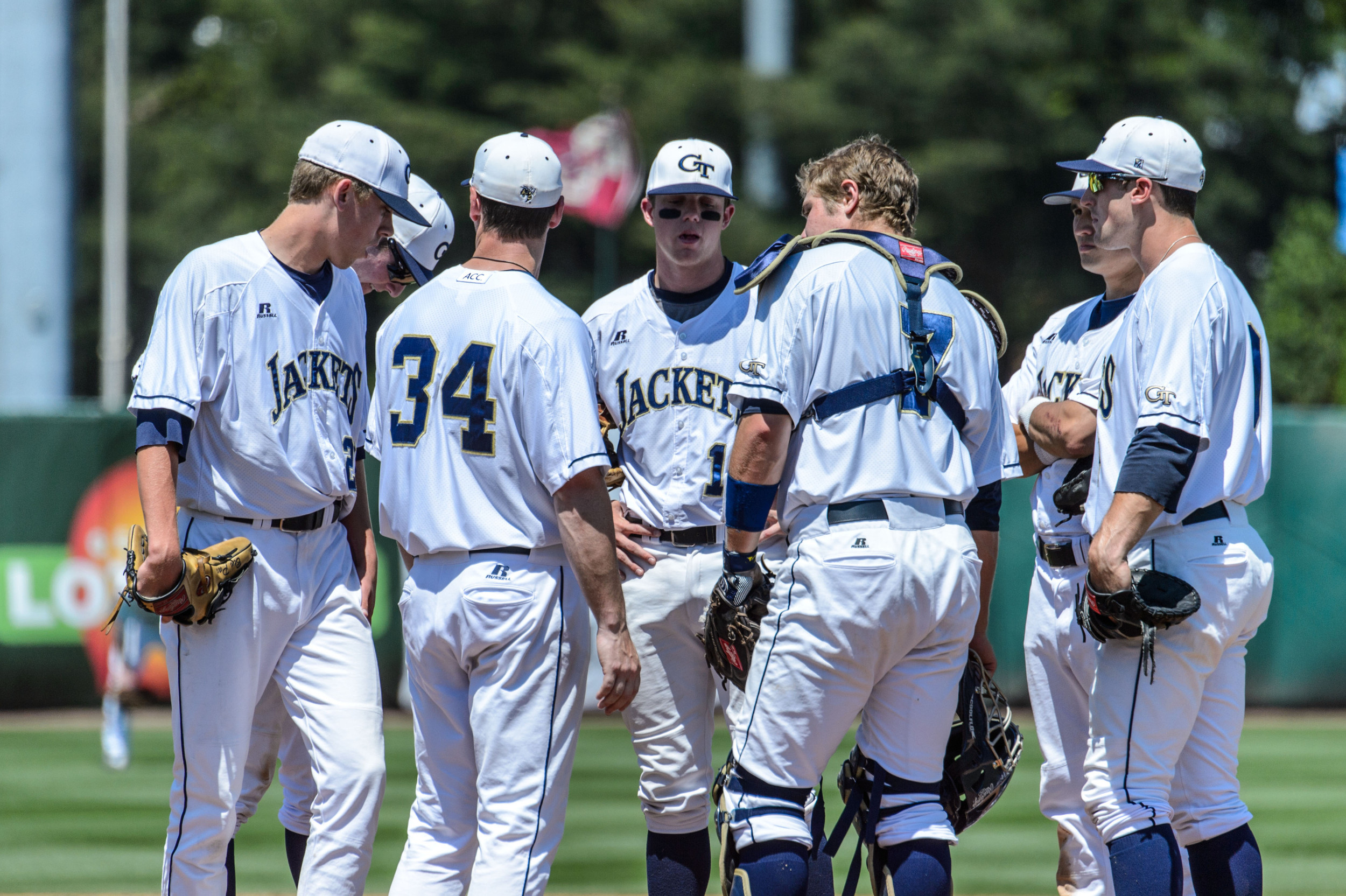 Pitching Coach Jason Howell (34) talks with the infield