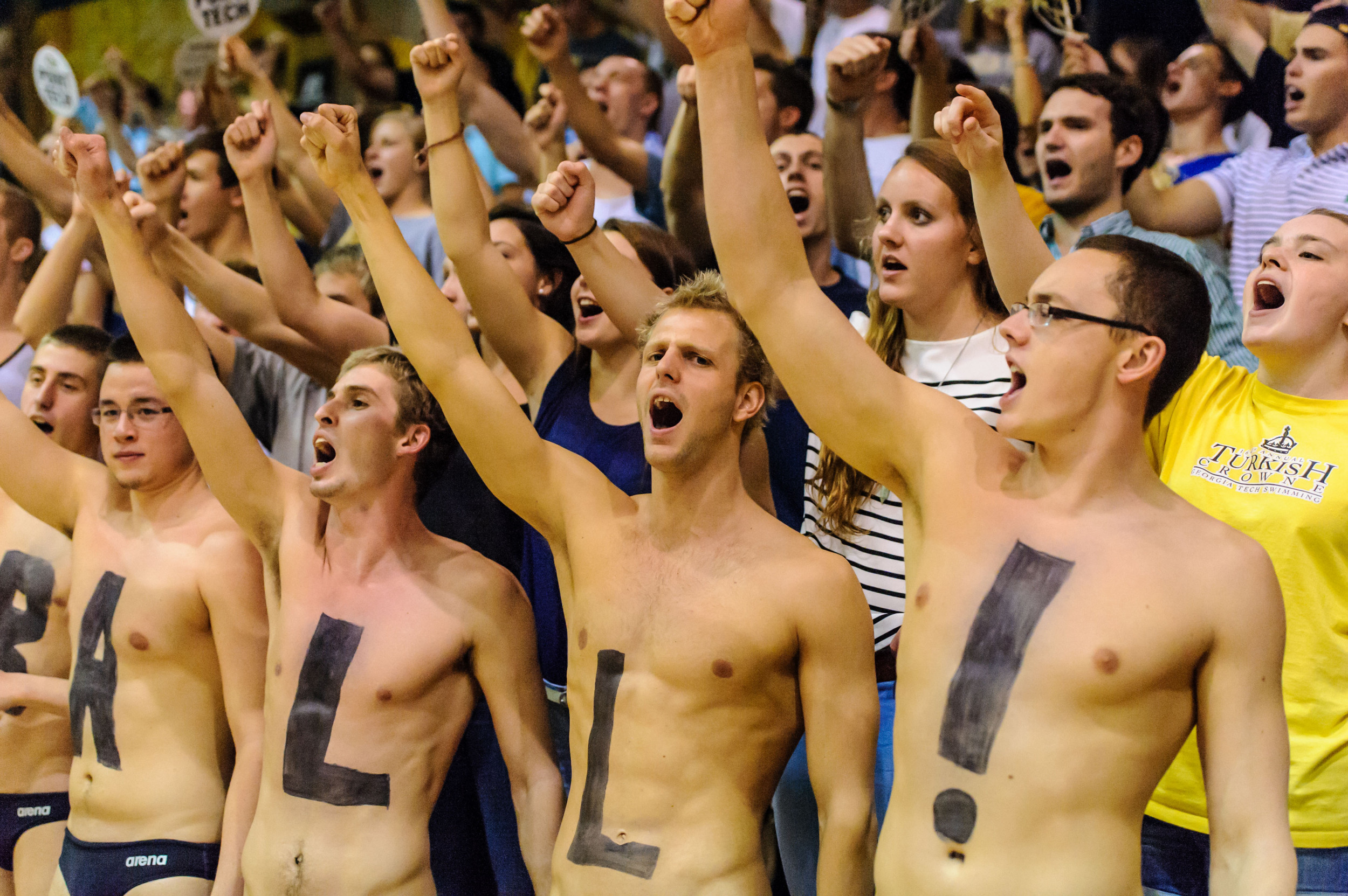 The GT Swimming and Diving team cheers on the Volleyball team