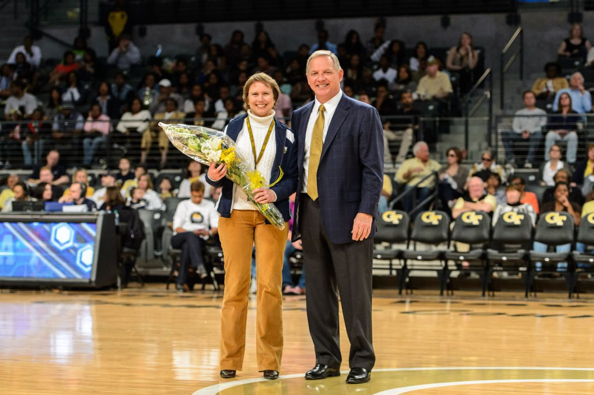 Director of Athletics Mike Bobinski and Faculty Representative Dr. Sue Ann Bidstrup Allen, who was also the guest coach.