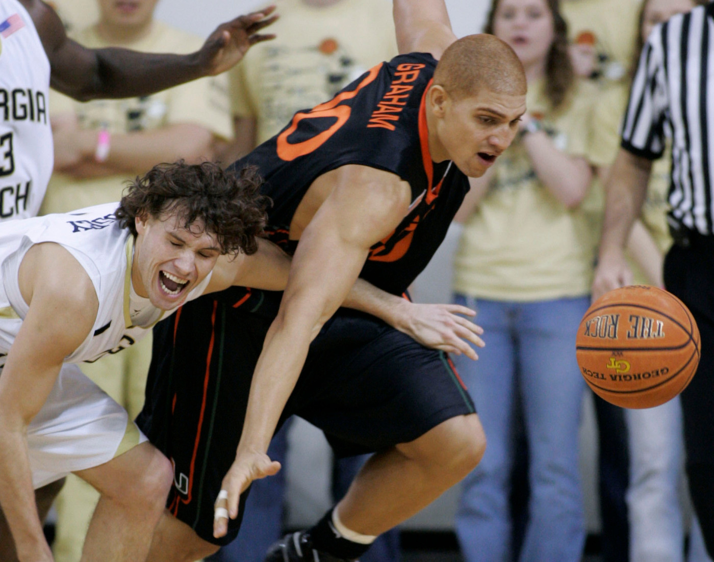 Georgia Tech guard Matt Causey, left, and Miami forward Jimmy Graham battle for a loose ball during the first half of a basketball game Sunday, Feb. 17, 2008, in Atlanta. Miami won 64-63. (AP Photo/John Amis)