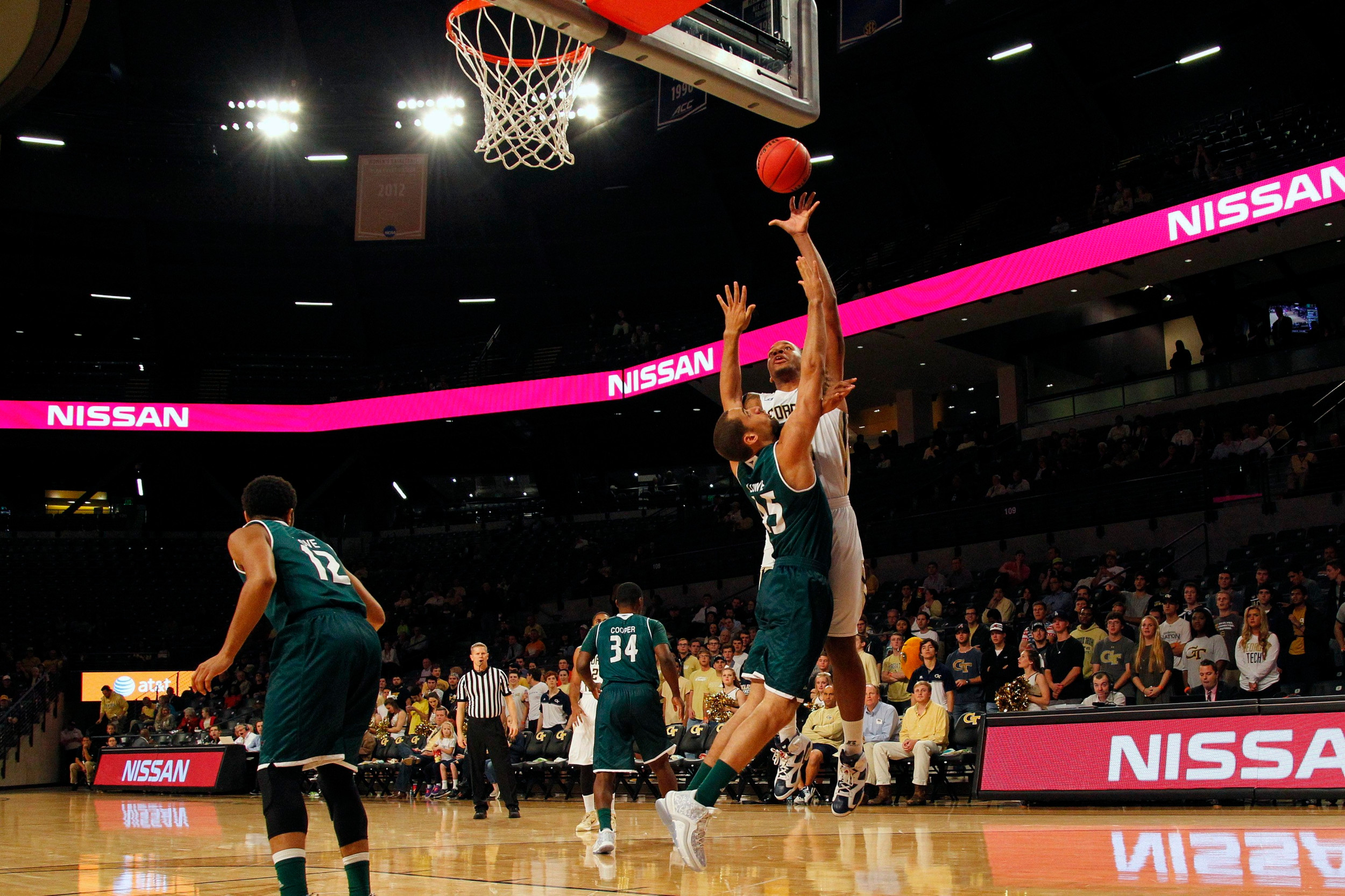 Yellow Jackets forward Nick Jacobs shoots the ball over Green Bay Phoenix forward Kenneth Lowe in the first half at McCamish Pavilion. Credit: Brett Davis-USA TODAY Sports