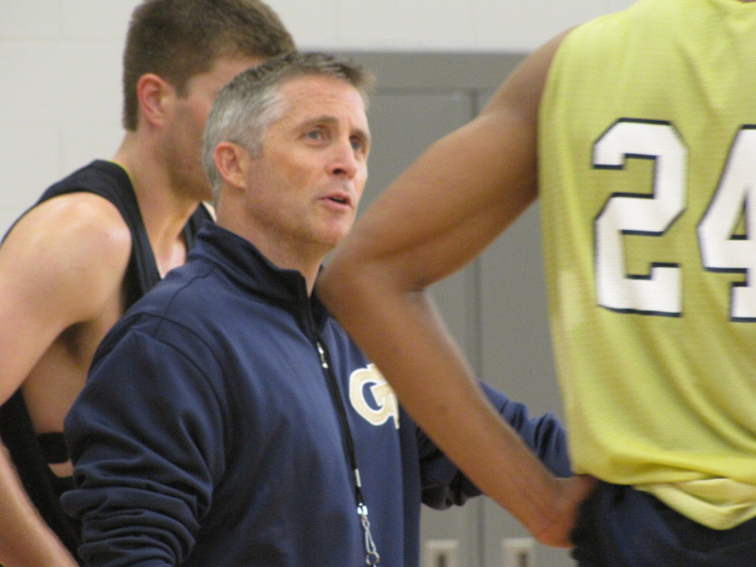 Brian Gregory gives instruction to Kammeon Holsey