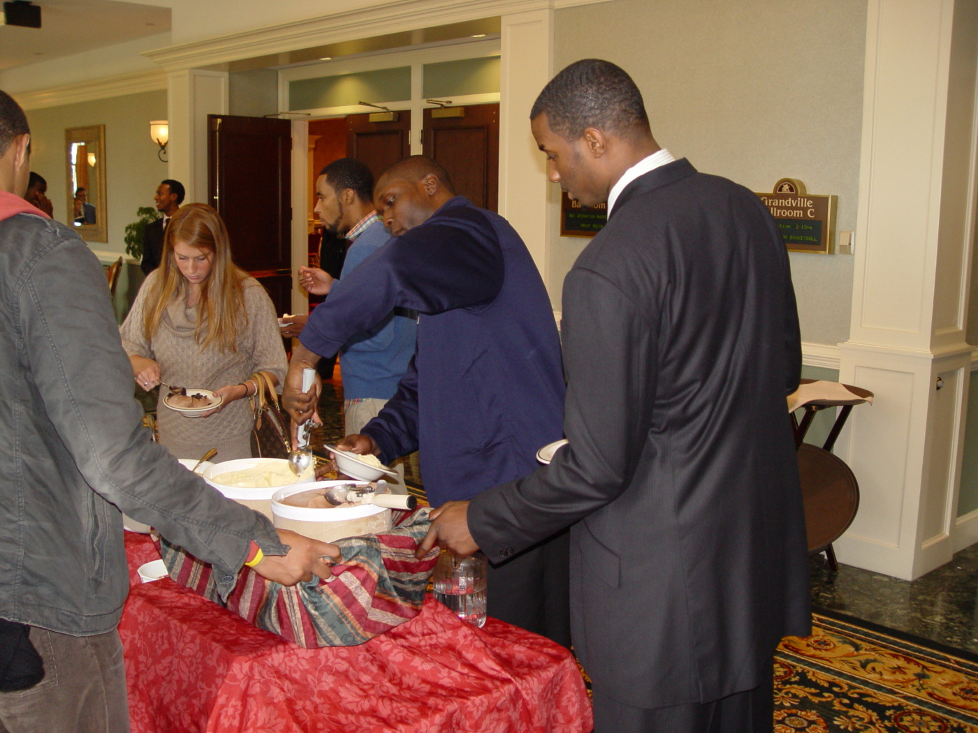 Gani Lawal helps himself to some ice cream during a break in the media session