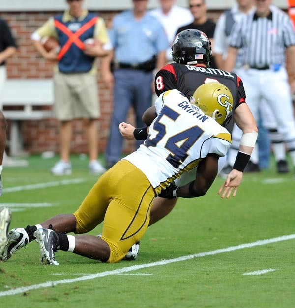 Sedric Griffin (54) brings down the Gardner-Webb quarterback. (Photo by LensEffects)