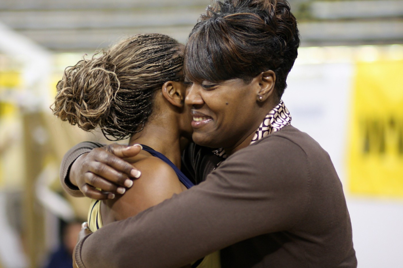 Janie Mitchell hugs her mom after scoring her 1,000th career point at Tech