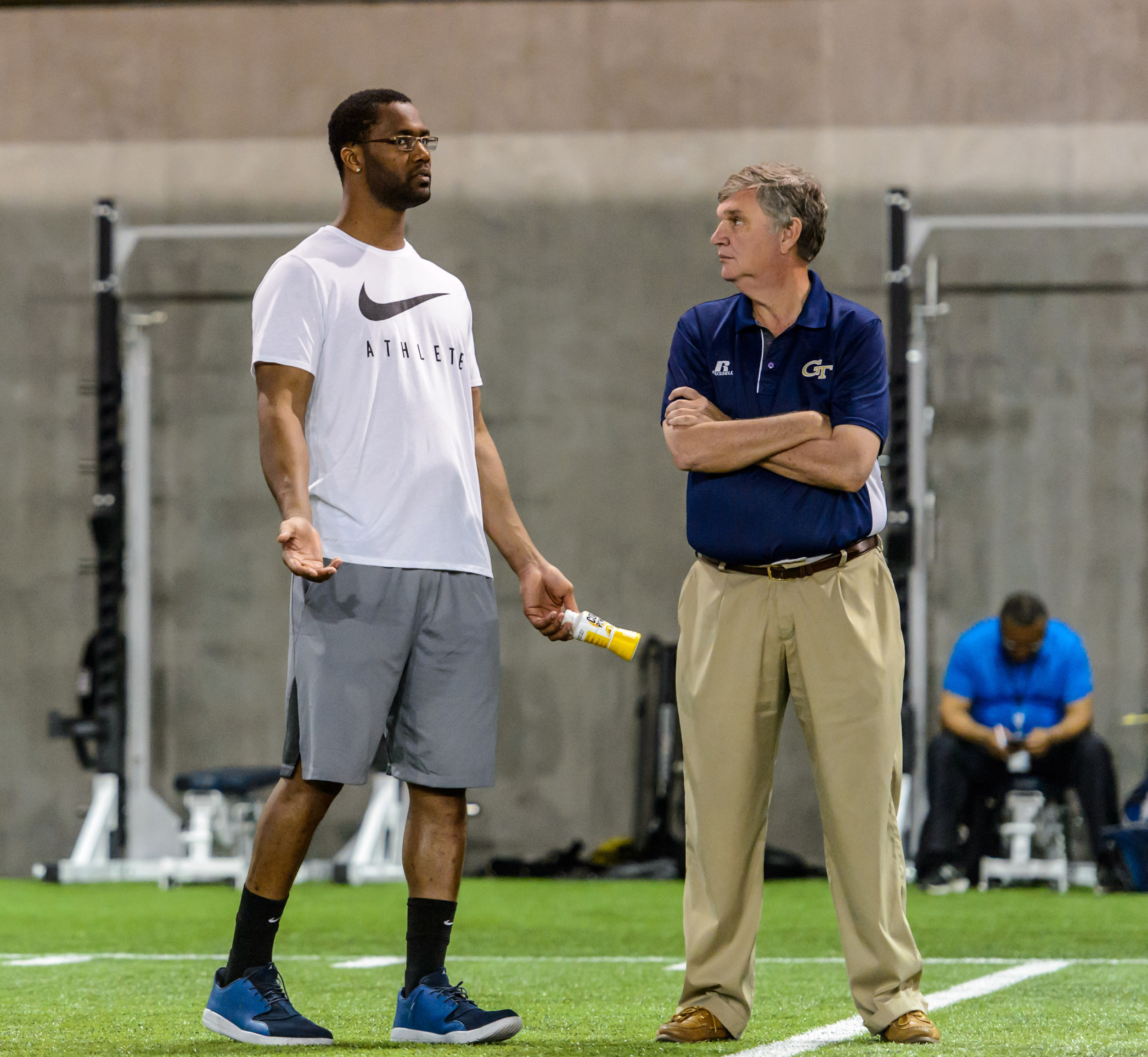 Coach Paul Johnson talks with former Yellow Jacket and current Cincinnati Bengal Michael Johnson