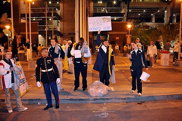 Georgia Tech student athletes help collect toys for the eighth-annual Michael Isenhour Toy Drive prior to the game against Miami. (Photo by Lenseffects)
