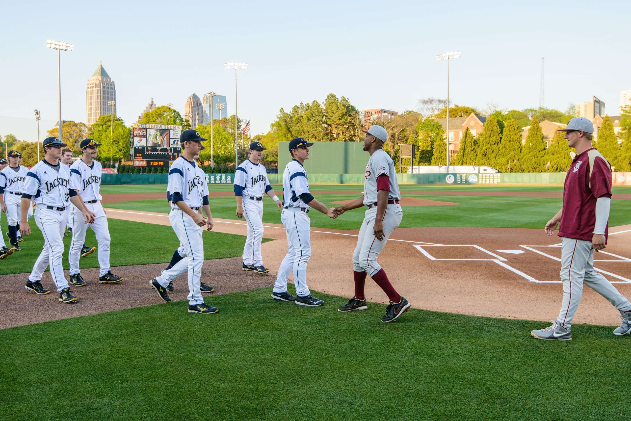 Yellow Jacket and Seminole players meet for the ACC Sportsmanship handshake
