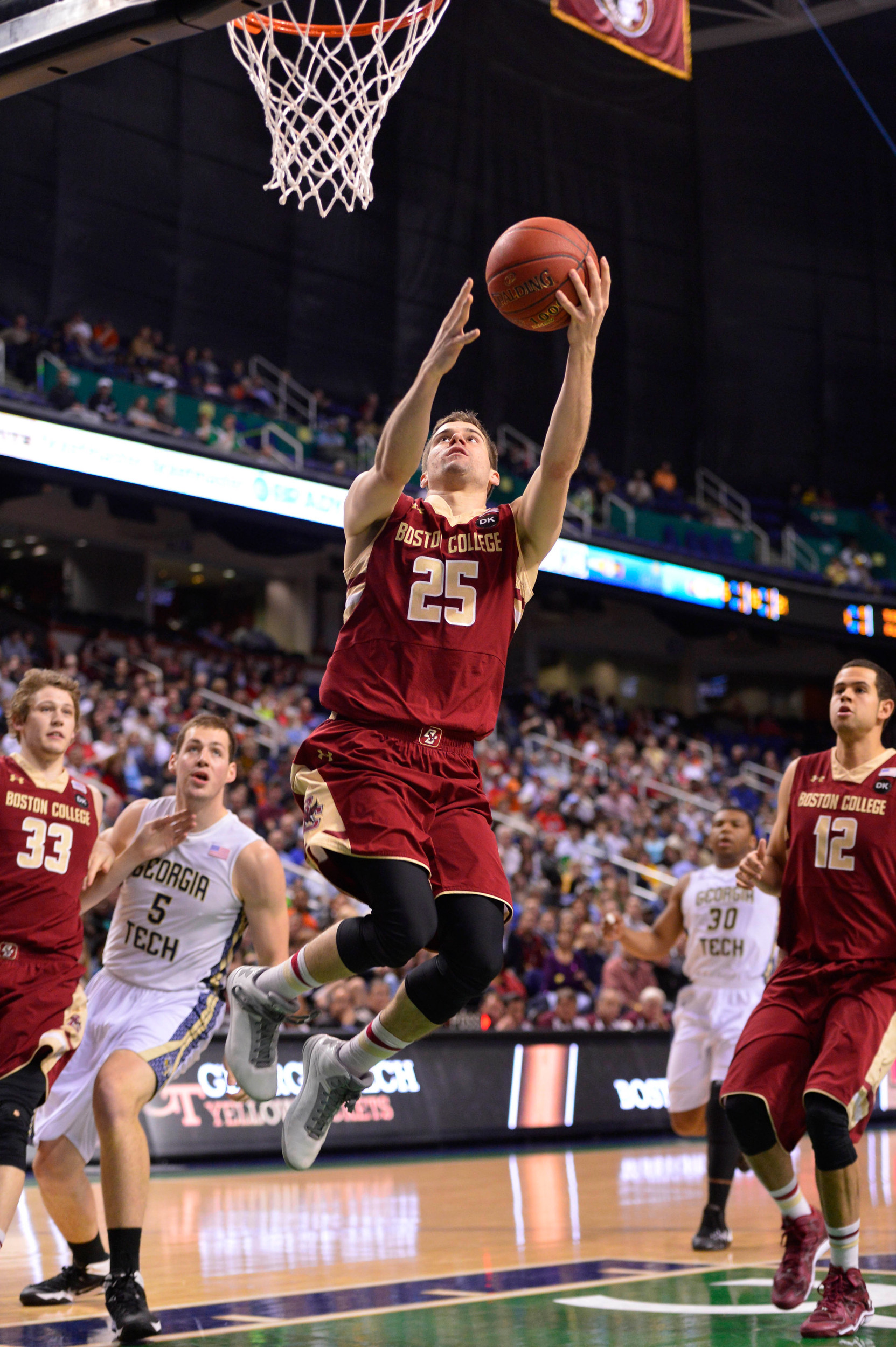 Mar 12, 2014; Greensboro, NC, USA; Boston College Eagles guard Joe Rahon (25) shoots in the first half in the first round at Greensboro Coliseum. Mandatory Credit: Bob Donnan-USA TODAY Sports