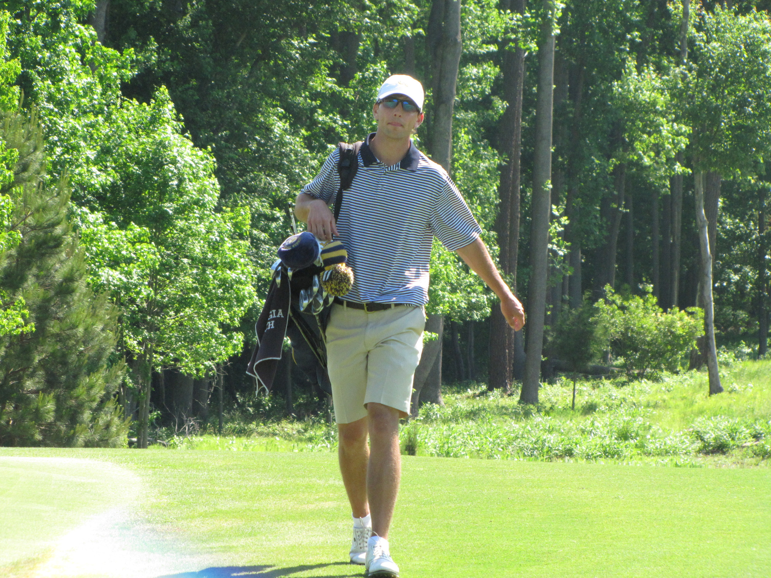 Seth Reeves walks up to the 5th green during the final round of the NCAA Raleigh Regional.