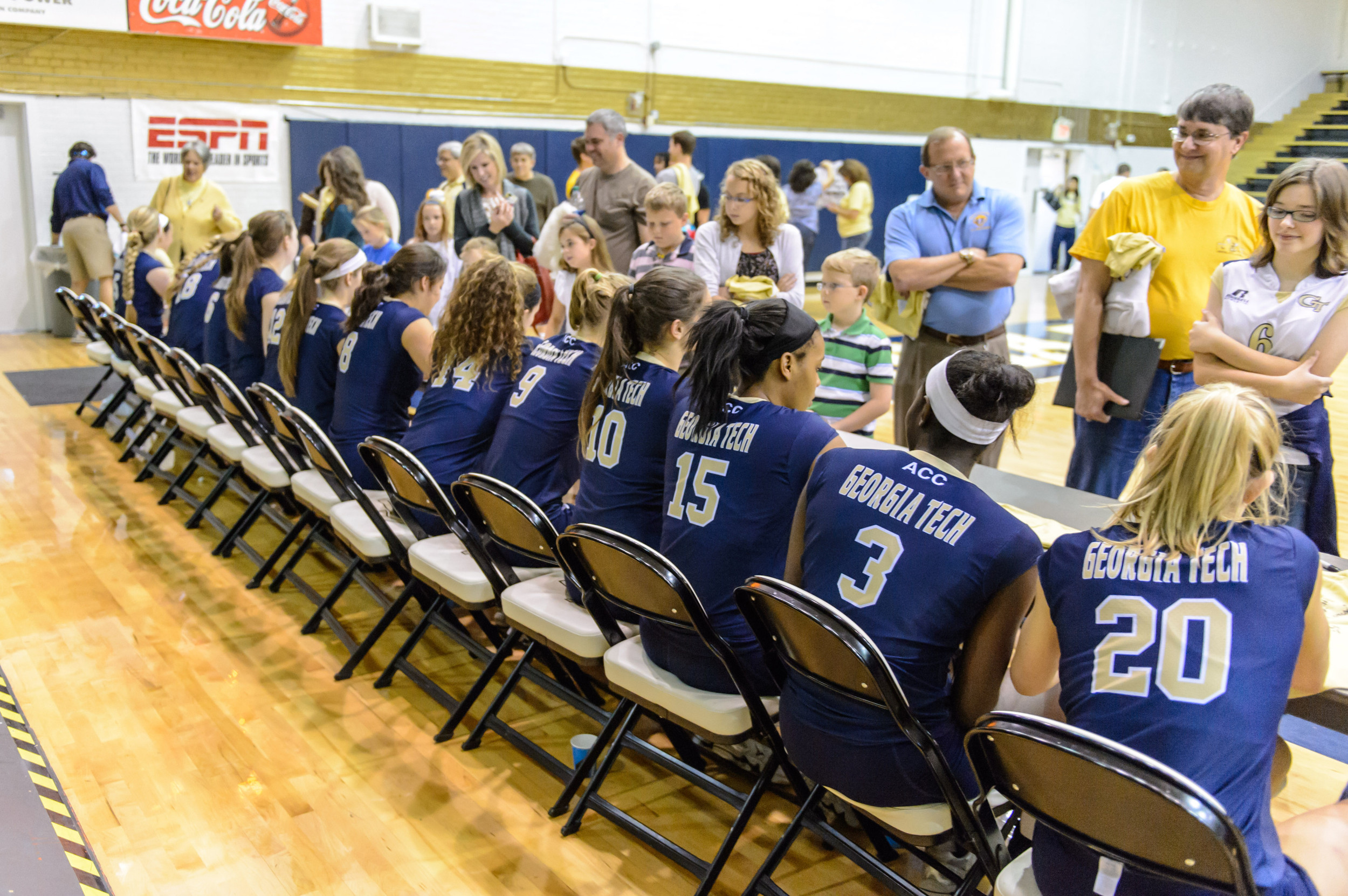 The team signs autographs after the game.