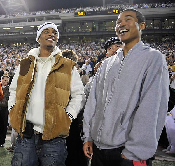 Music star T.I. enjoys the game and cheers on the Yellow Jackets. (Photo by Lenseffects)