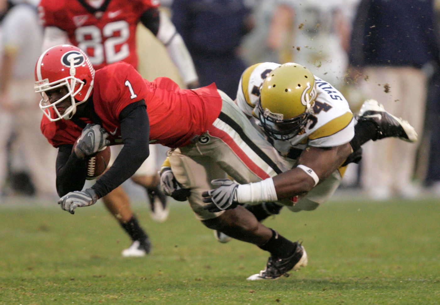 Georgia receiver Mohammed Massaquoi is stopped by Steven Sylvester after making a catch for a first down in the fourth quarter in Athens, Ga., , Saturday, Nov. 29, 2008. Tech won 45-42. (AP Photo/John Bazemore)