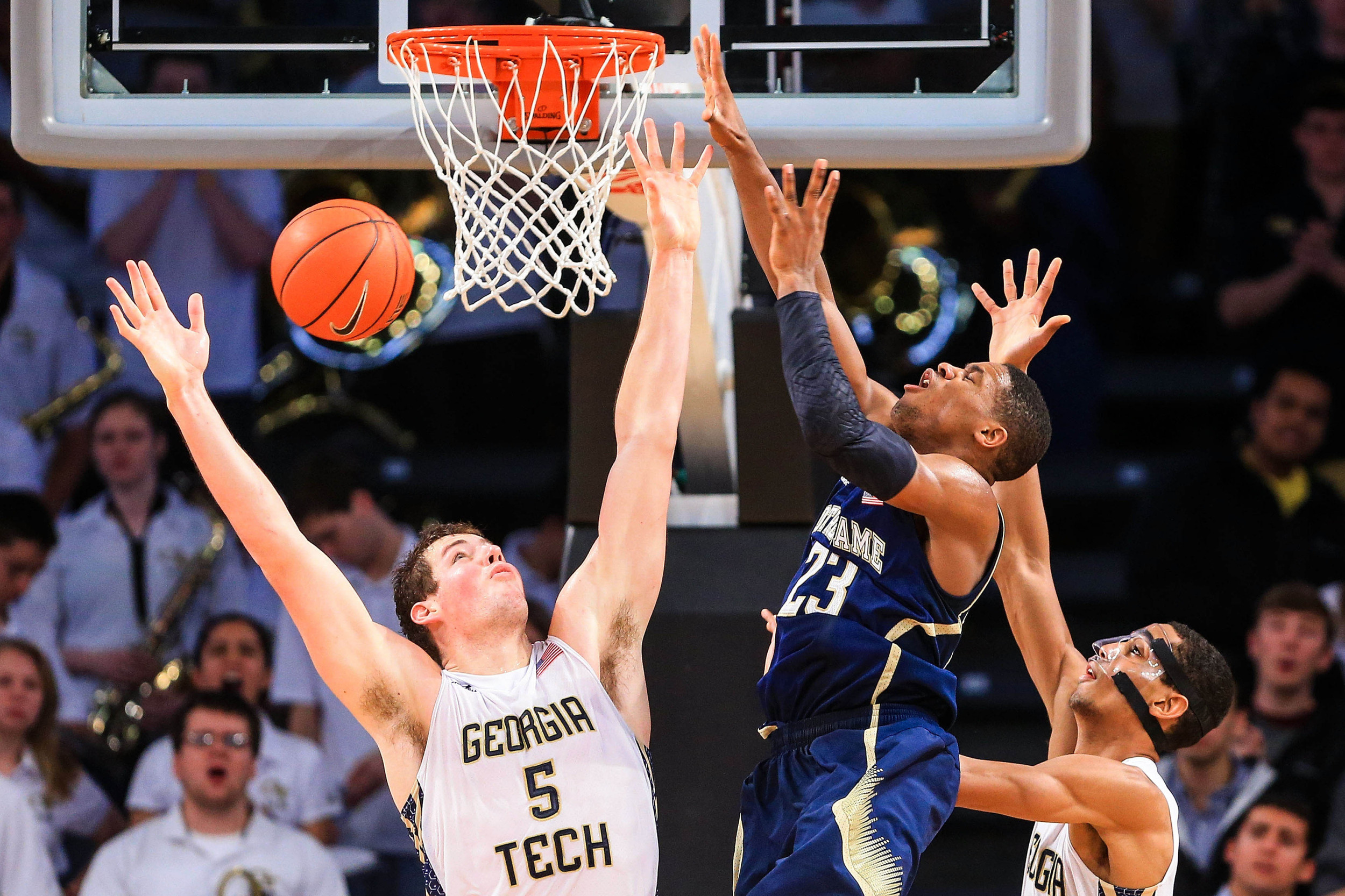 Jan 11, 2014; Atlanta, GA, USA; Georgia Tech Yellow Jackets center Daniel Miller (5) blocks a shot by Notre Dame Fighting Irish guard Demetrius Jackson (23) in the second half at Hank McCamish Pavilion. Georgia Tech won 74-69. Mandatory Credit: Daniel Shirey-USA TODAY Sports