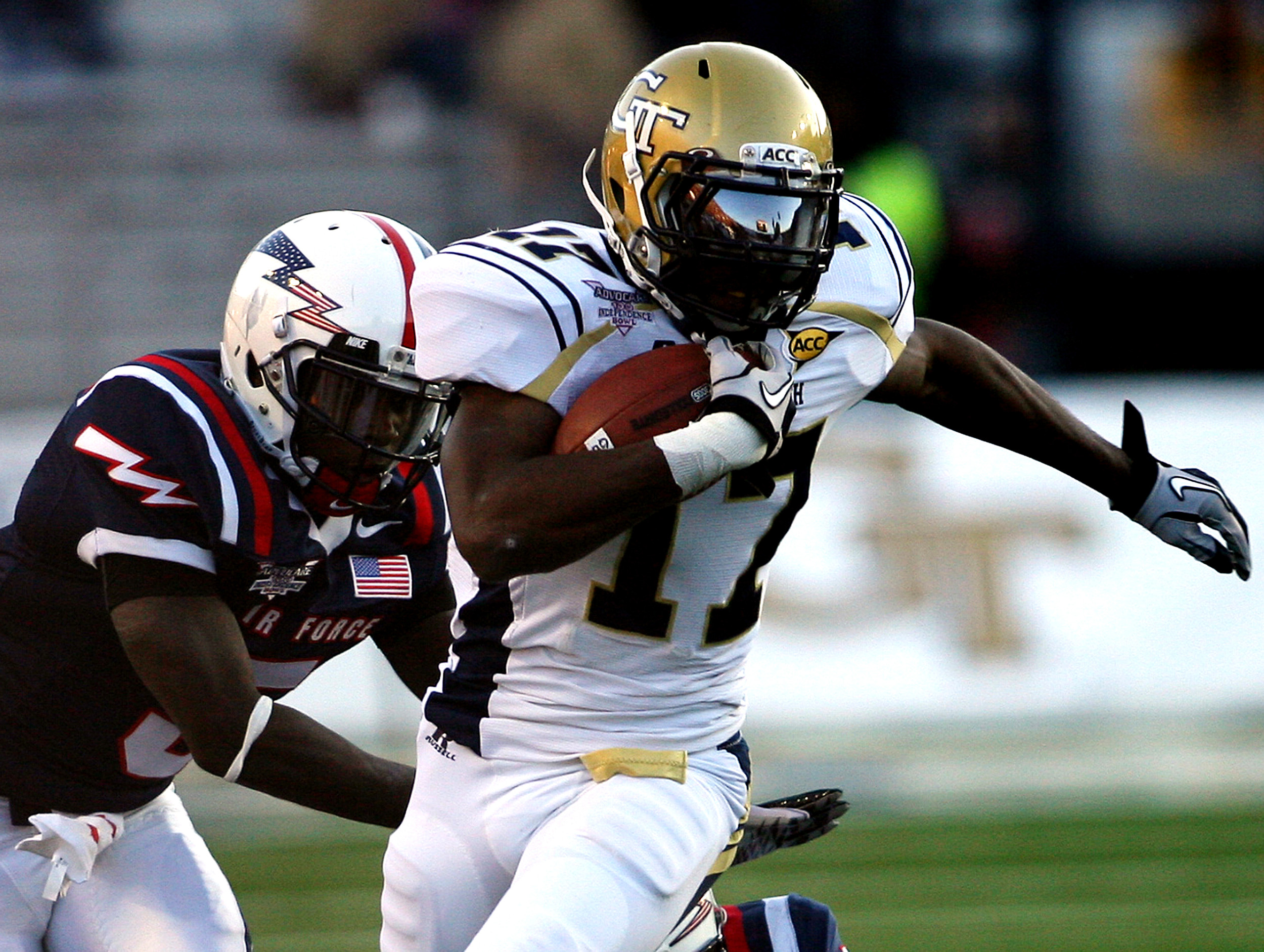 Georgia Tech running back Orwin Smith runs past Air Force Academy defender Anthony Wright, Jr. during the first half of the Independence Bowl football game, Monday, Dec. 27, 2010, in Shreveport, La. (AP Photo/Charles Smith)