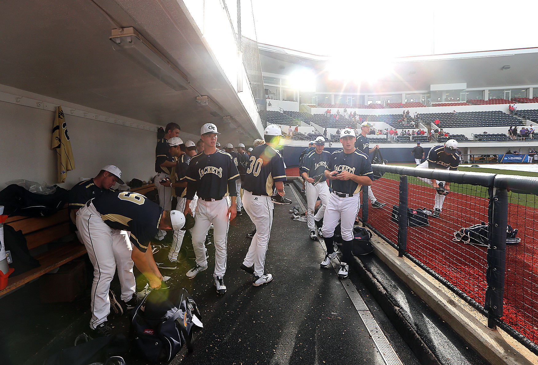 Georgia Tech players pack up the dugout after learning Friday's games were postponed (Photo by Josh McCoy)