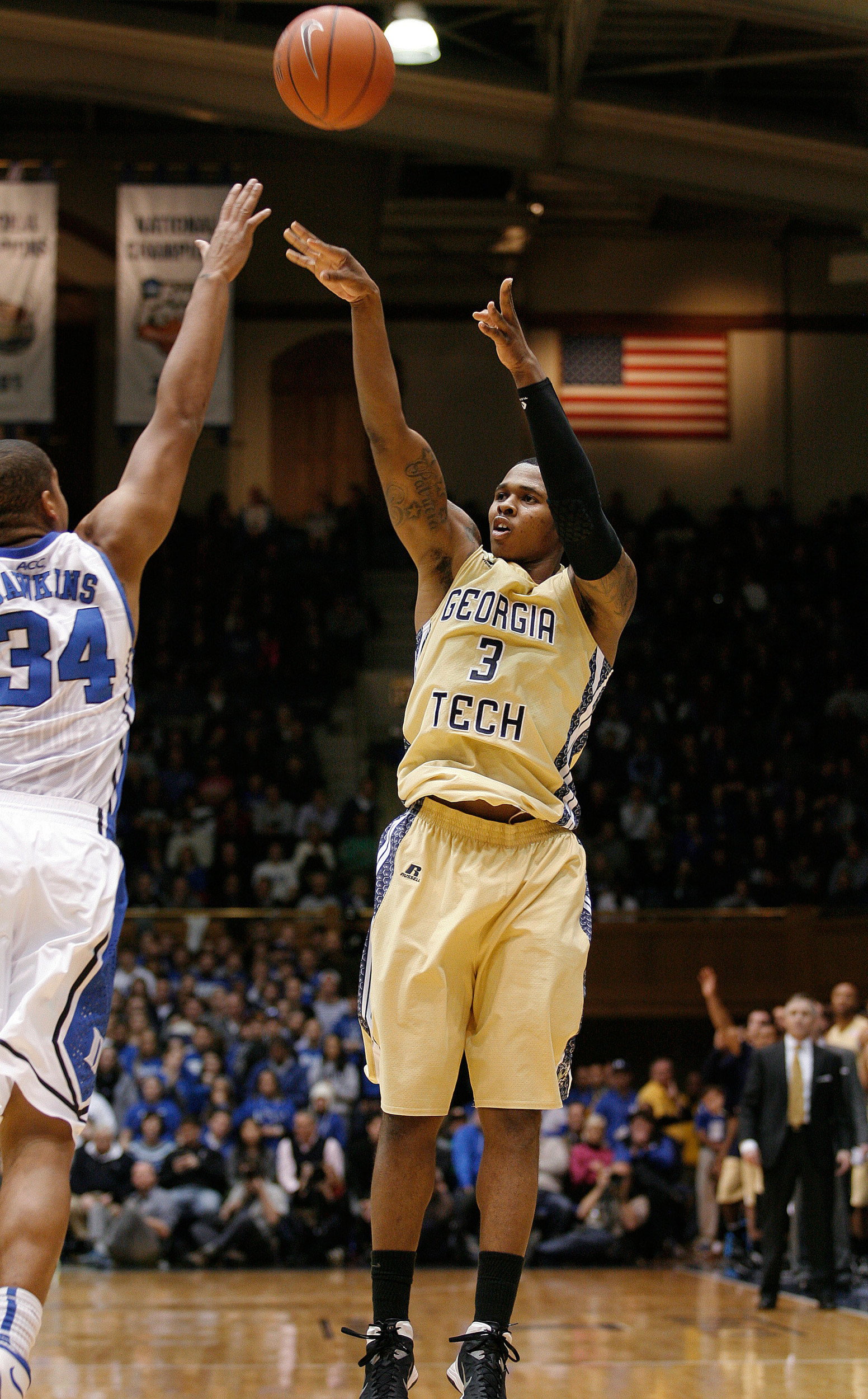 Jan 7, 2014; Durham, NC, USA; Georgia Tech Yellow Jackets guard/forward Marcus Georges-Hunt (3) shoots the ball over Duke Blue Devils guard Andre Dawkins (34) at Cameron Indoor Stadium. Mandatory Credit: Mark Dolejs-USA TODAY Sports