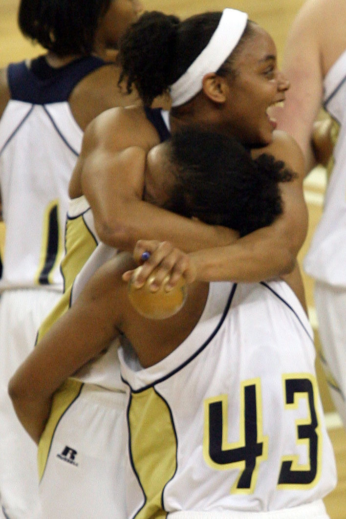 Georgia Tech's Chioma Nnamaka bottom, hugs teammate Jill Ingram after their 77-72 victory over No. 4 Maryland, Thursday, Feb. 1, 2007, during a college basketball game in Atlanta. (AP Photo/The Atlanta Journal Constitution, Mikki K. Harris)