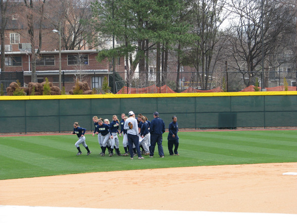 Softball team practices in its new stadium for the first time.