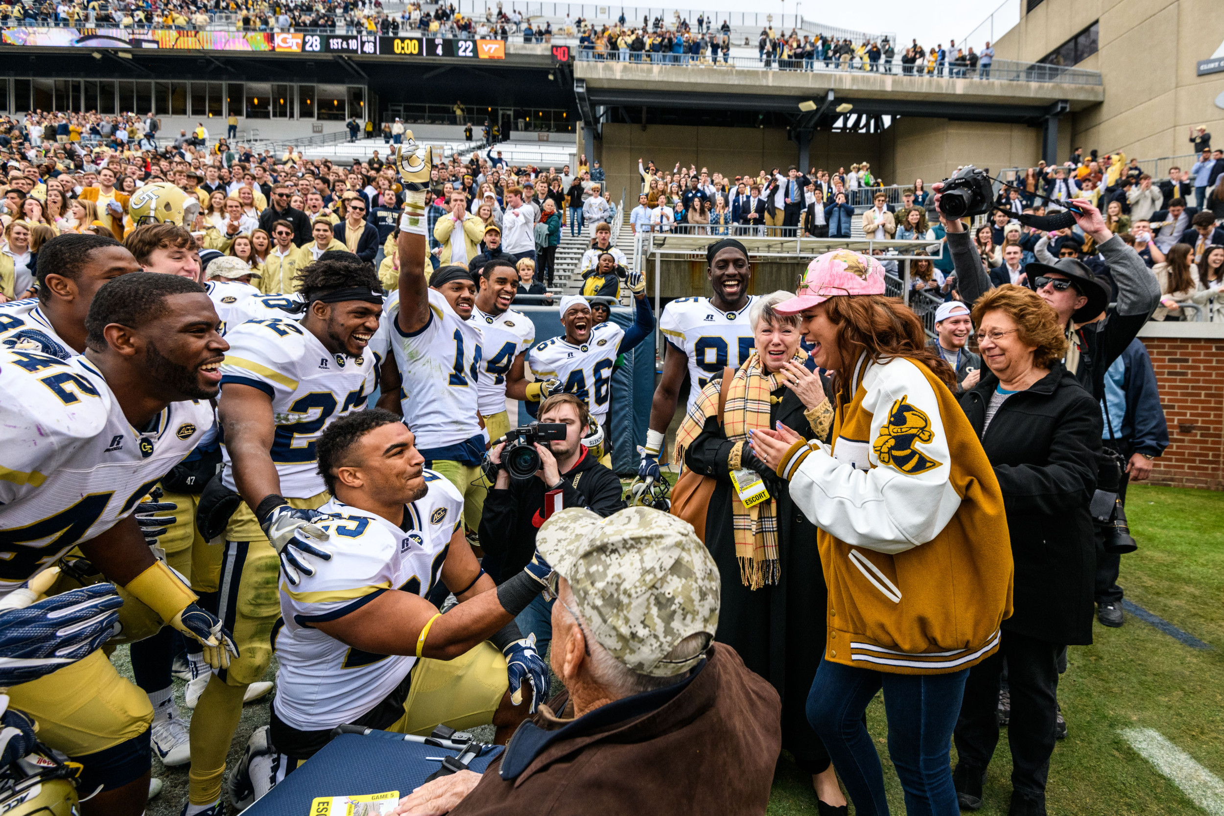 Linebacker Tre' Jackson (25) proposed to his girlfriend, Desiree', after the win. She said yes!