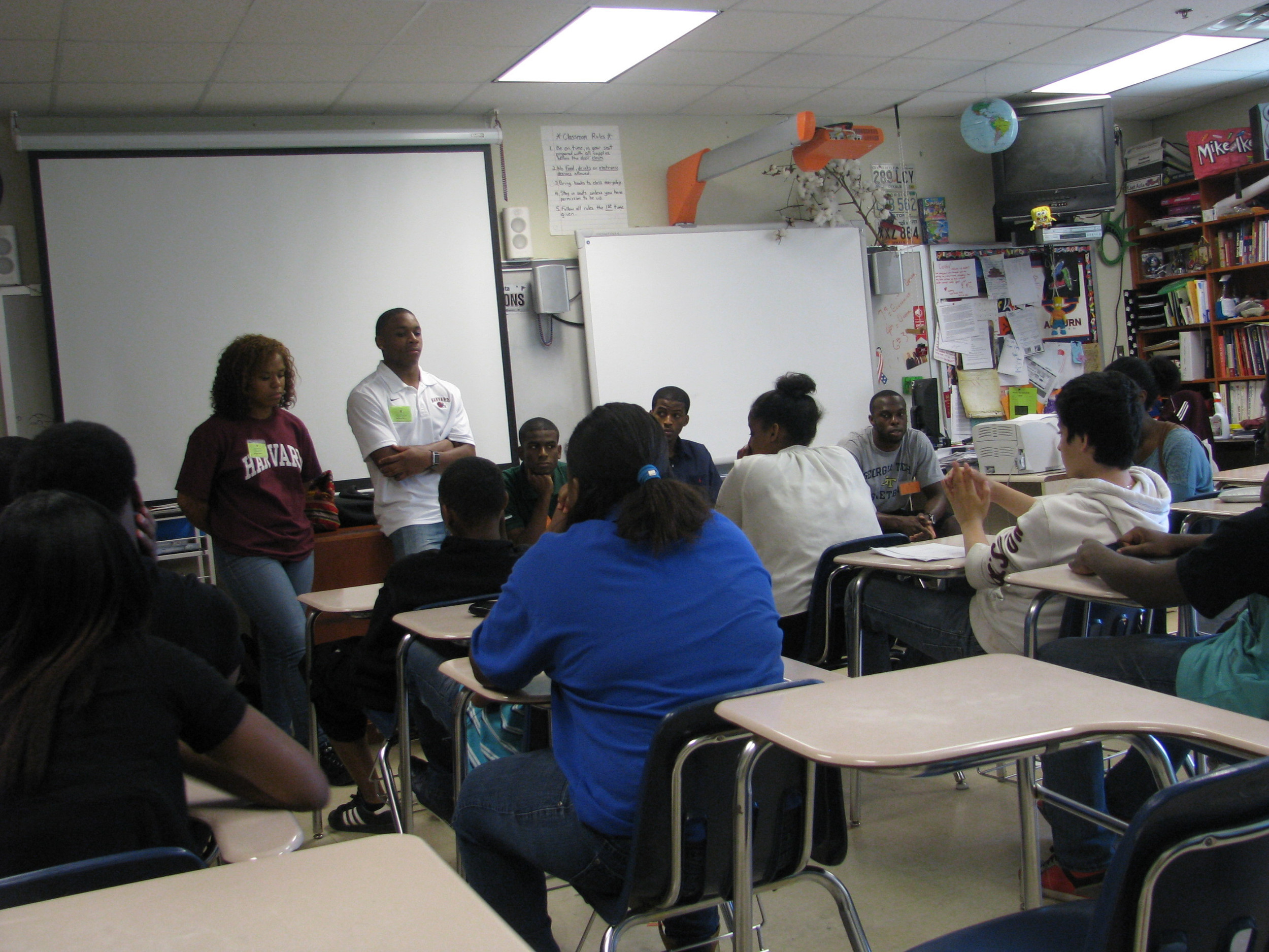 Mfon Udofia joins other college students from the area to speak to Tucker Middle School students about college life and preparing for college.