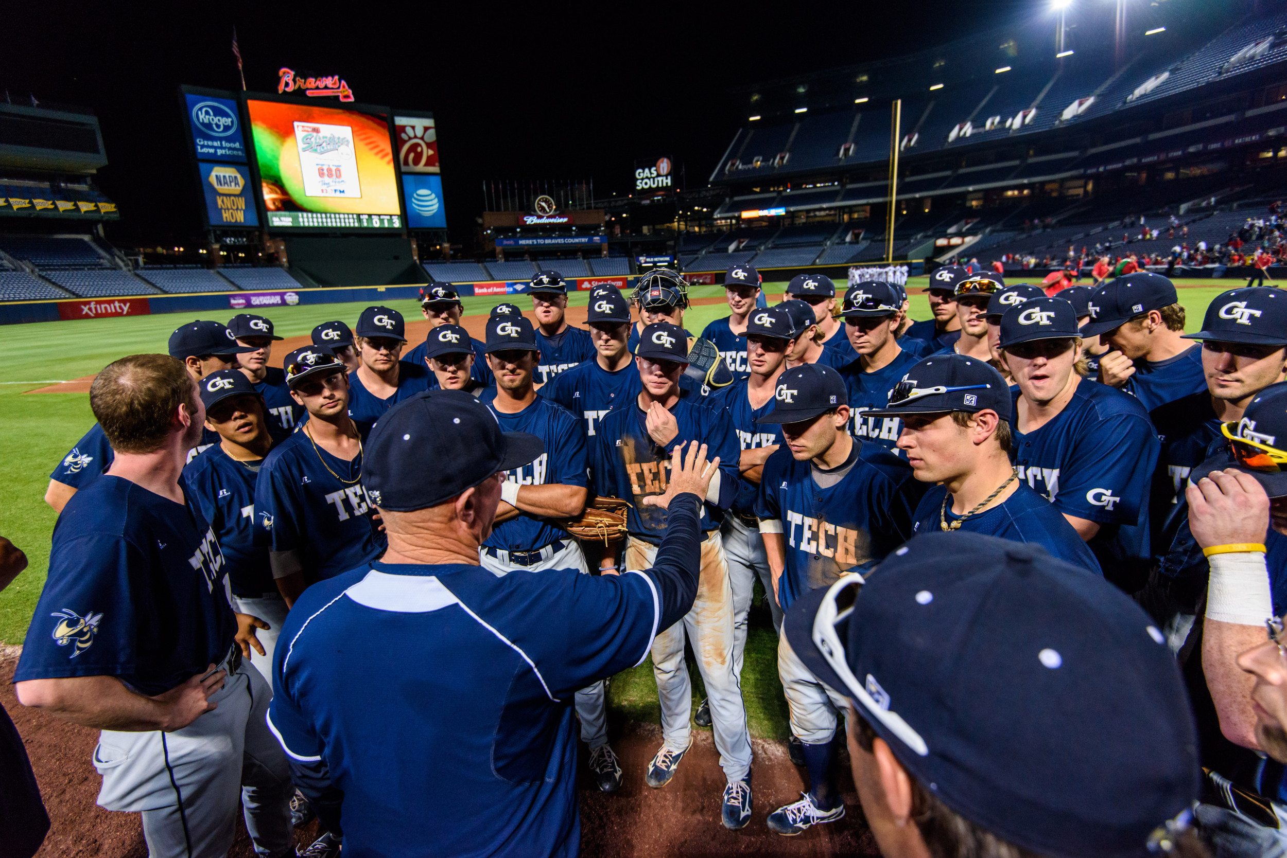 Coach Hall talks to the team after the win