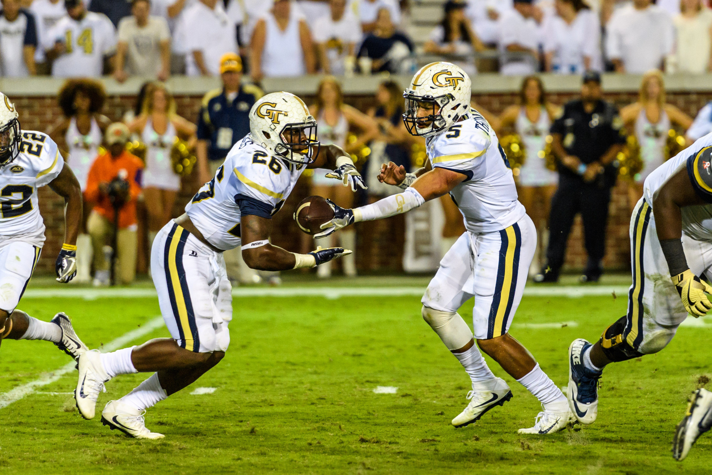 Dedrick Mills (26) takes the ball from Justin Thomas (5) against No. 5 Clemson on Sept. 22, 2016.