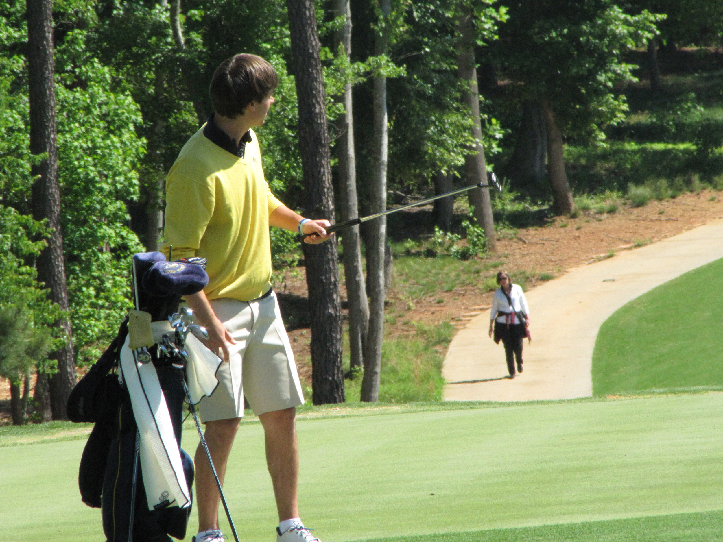 Ollie Schniederjans watches his birdie putt on the 3rd green during the final round of the NCAA Raleigh Regional.
