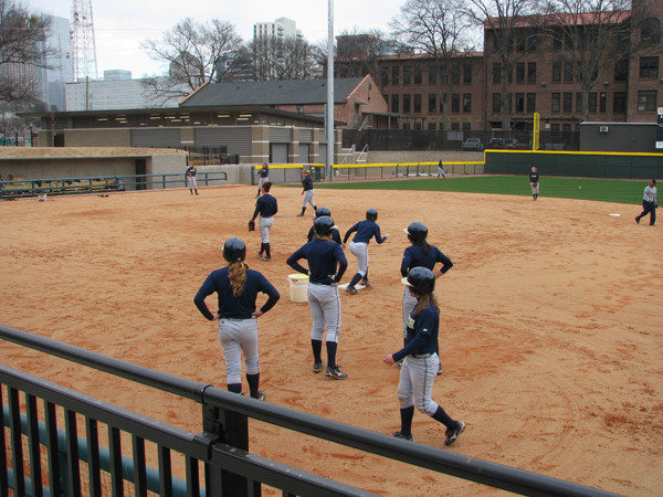 Softball team practices in its new stadium for the first time.