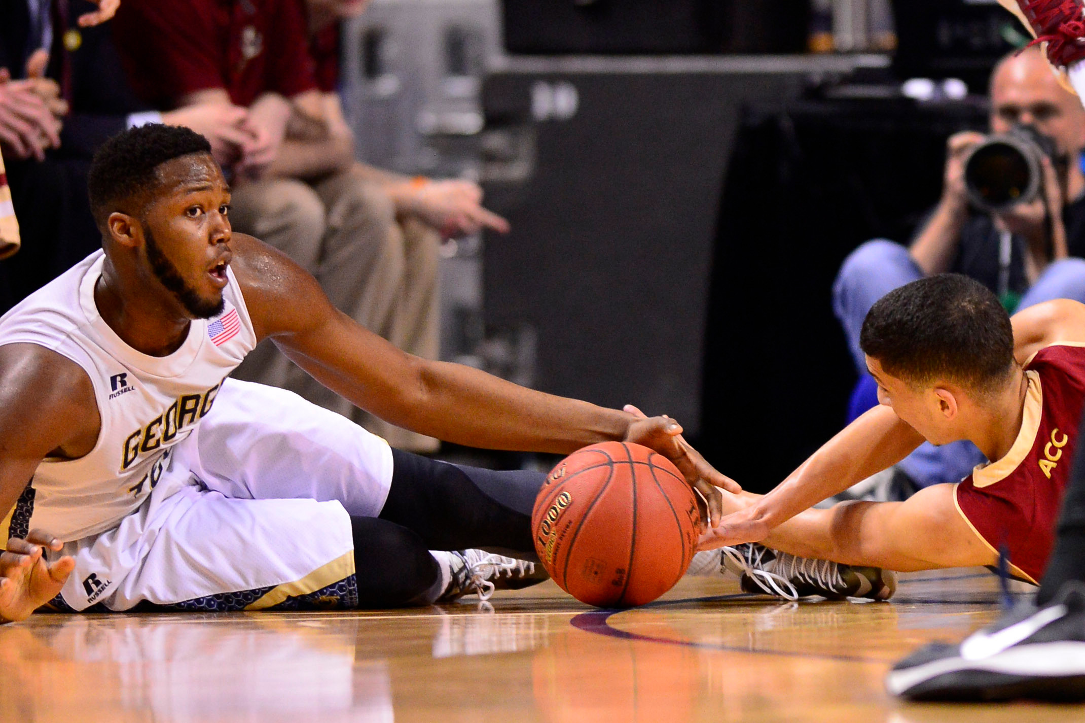 Mar 12, 2014; Greensboro, NC, USA; Georgia Tech Yellow Jackets forward Robert Carter, Jr. (4) and Boston College Eagles guard Lonnie Jackson (20) fight for the ball in the first half in the first round at Greensboro Coliseum. Mandatory Credit: Bob Donnan-USA TODAY Sports