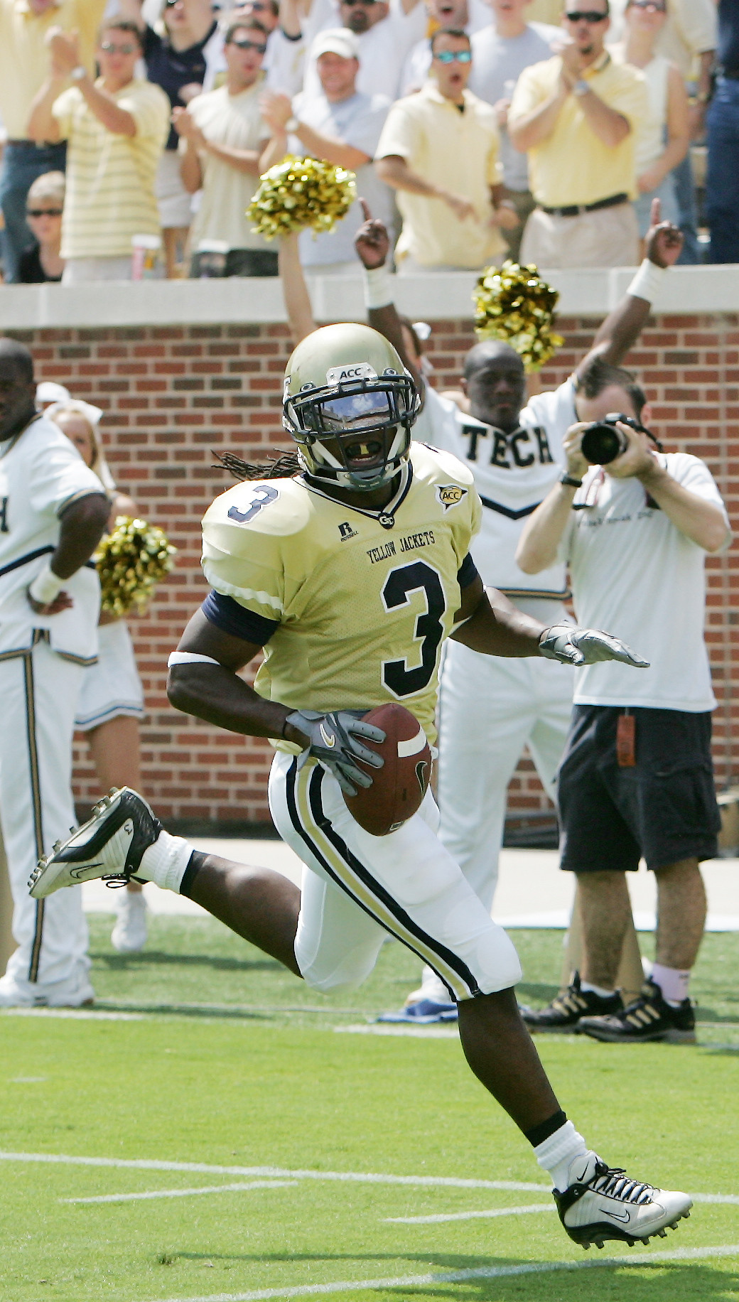 Georgia Tech fans celebrate as tailback Rashaun Grant scores against Troy in the first half. (AP Photo/Ric Feld)