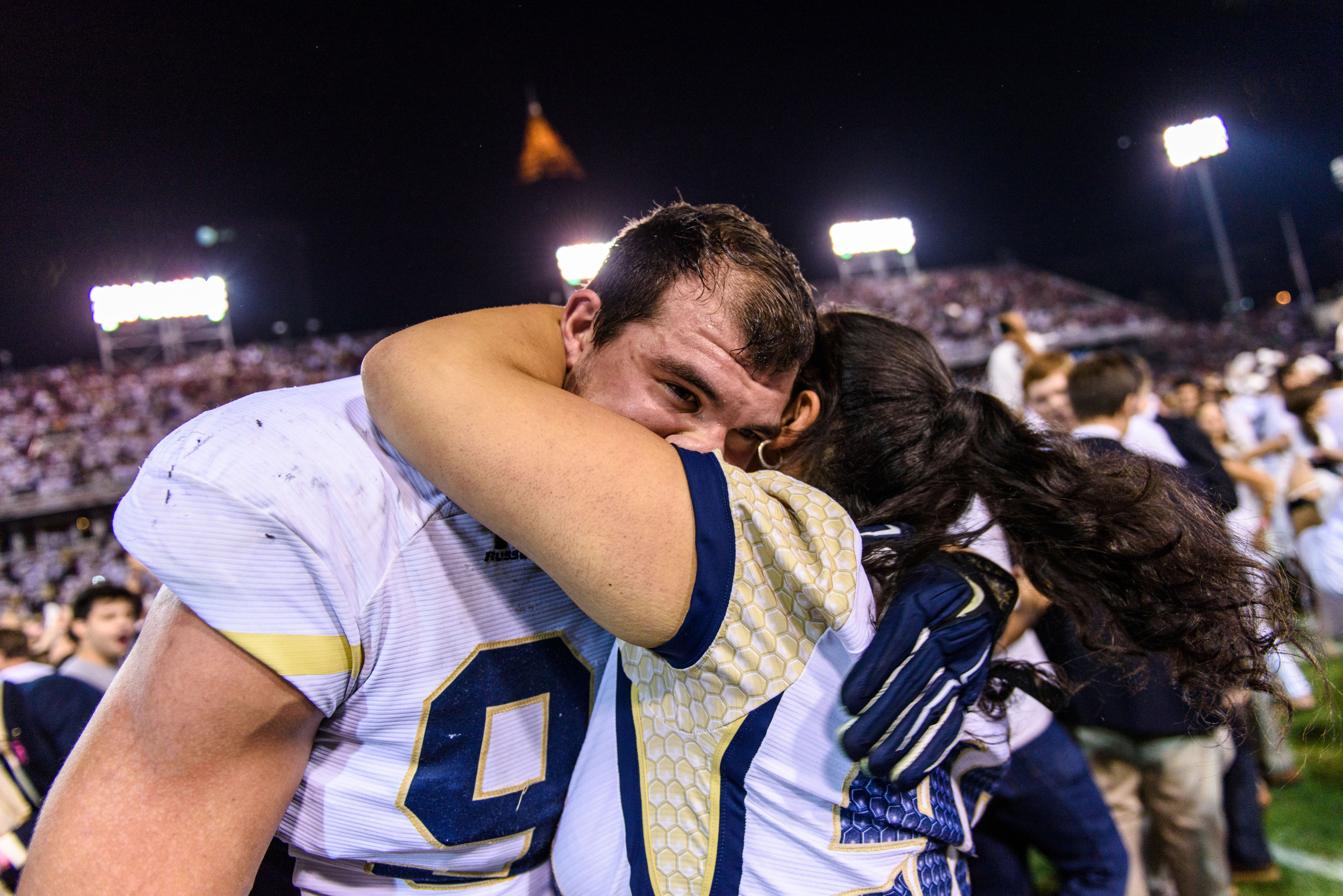 Adam Gotsis (96) and his sister hug after the win