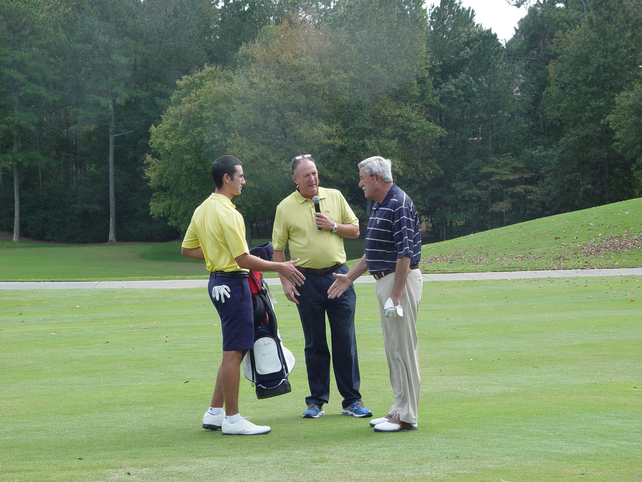 Chris Petefish and Bruce Heppler make a presentation to Carey Brown at the Ramblinwreck Cup - Golf Club of Georgia, October 5, 2015