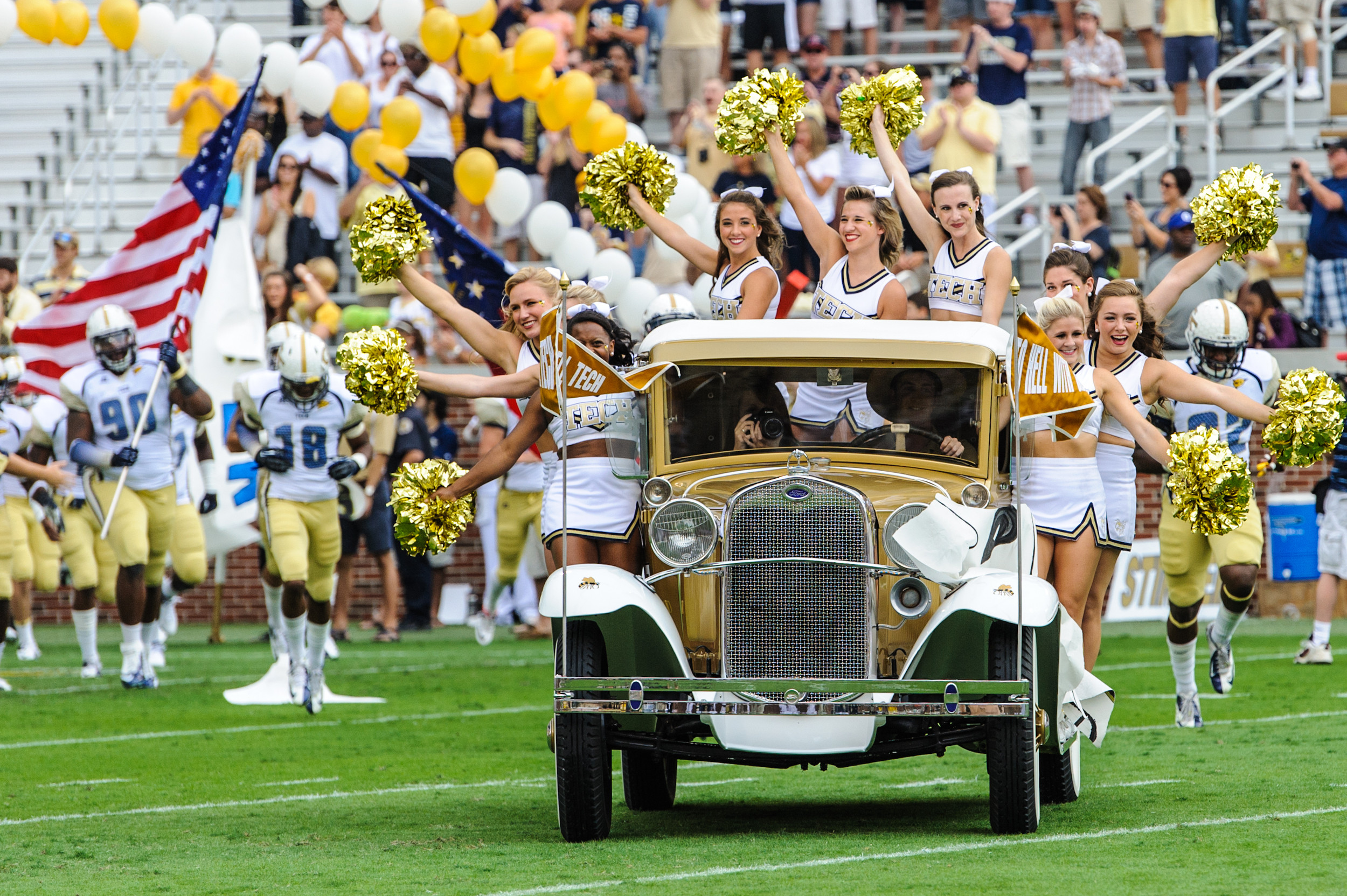 The Ramblin' Reck leads the team onto the field.