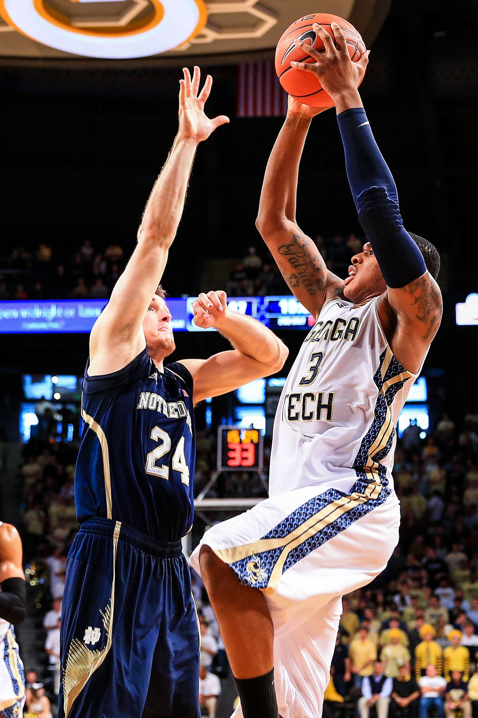 Jan 11, 2014; Atlanta, GA, USA; Georgia Tech Yellow Jackets forward Marcus Georges-Hunt (3) shoots a basket over Notre Dame Fighting Irish guard/forward Pat Connaughton (24) in the second half at Hank McCamish Pavilion. Georgia Tech won 74-69. Mandatory Credit: Daniel Shirey-USA TODAY Sports