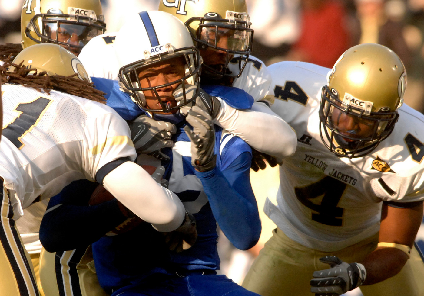 Duke's Eron Riley, center, is pulled down by Georgia Tech defenders Morgan Burnett, center, Jamal Lewis (4) and Philip Wheeler, left, during the second half half.
