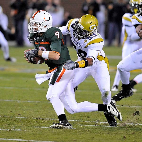 Kyle Jackson (59) tackles Miami QB Robert Marve. (Photo by LensEffects)
