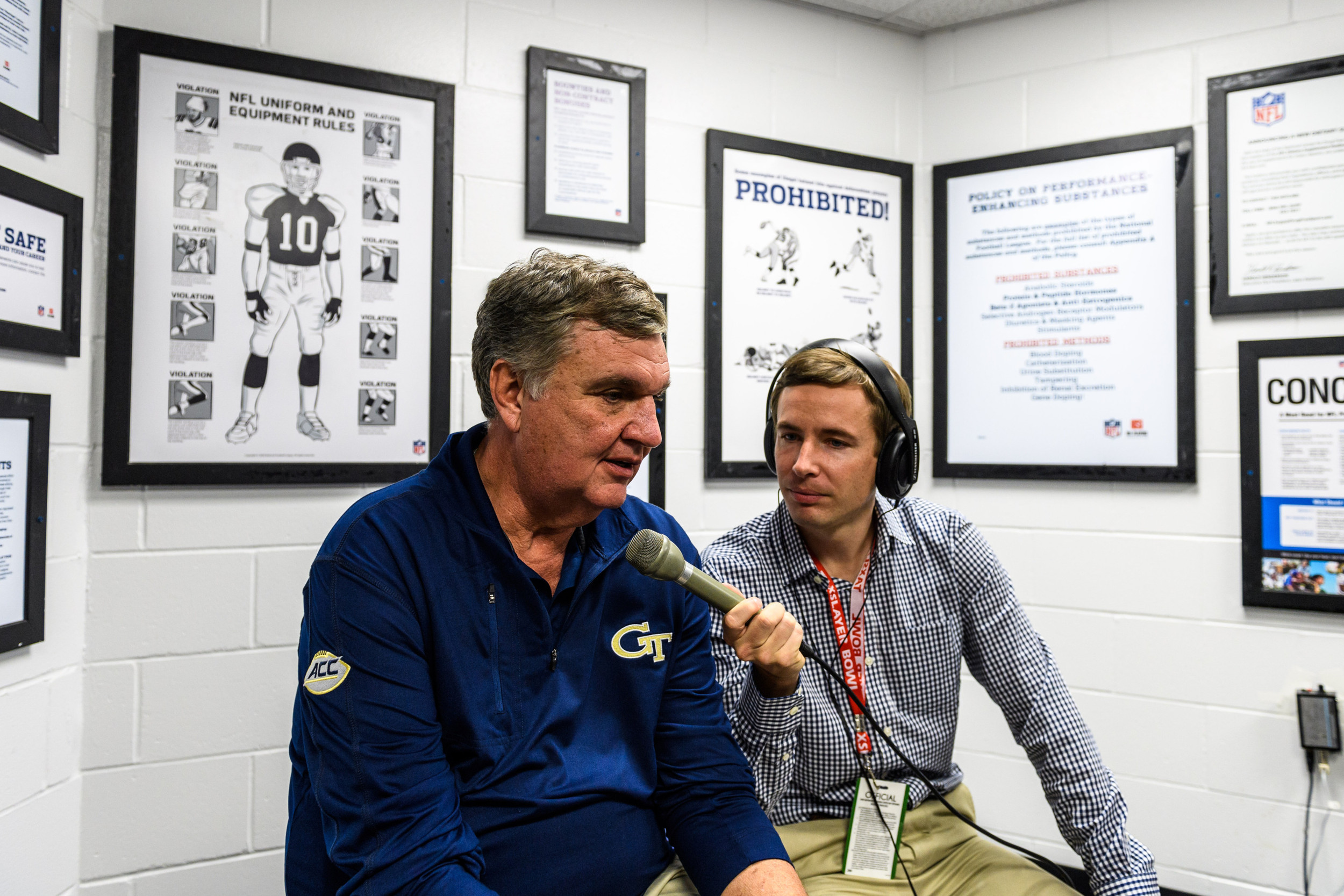Coach Paul Johnson talks with Andy Demetra after the game