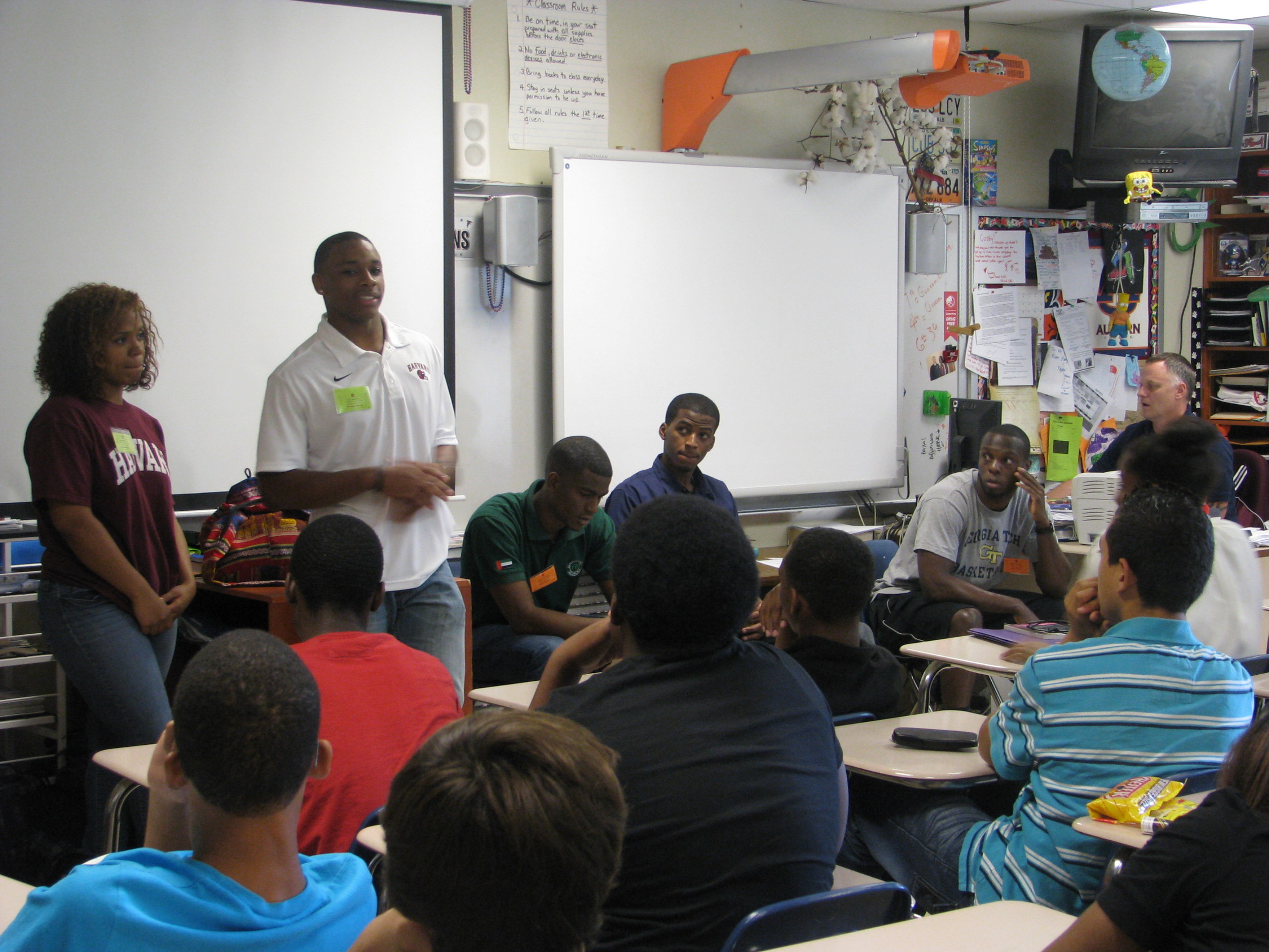 Mfon Udofia joins other college students from the area to speak to Tucker Middle School students about college life and preparing for college.