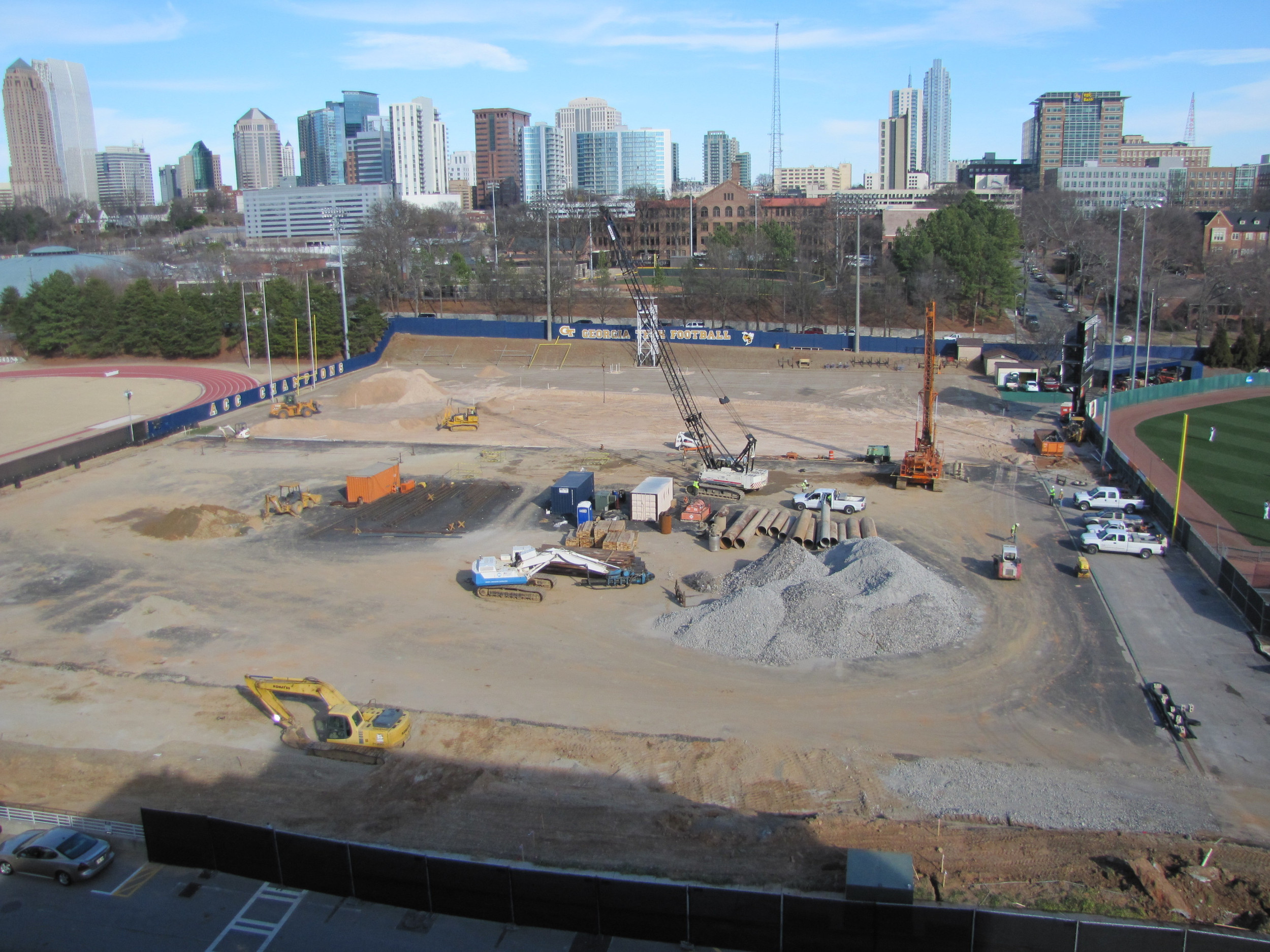 Week 7 - Photo taken on Feb. 15, 2011 - Barton Malow has taken down a light pole, has cleared more dirt from around the edge of the foot print and is finishing up drilling holes for foundation.