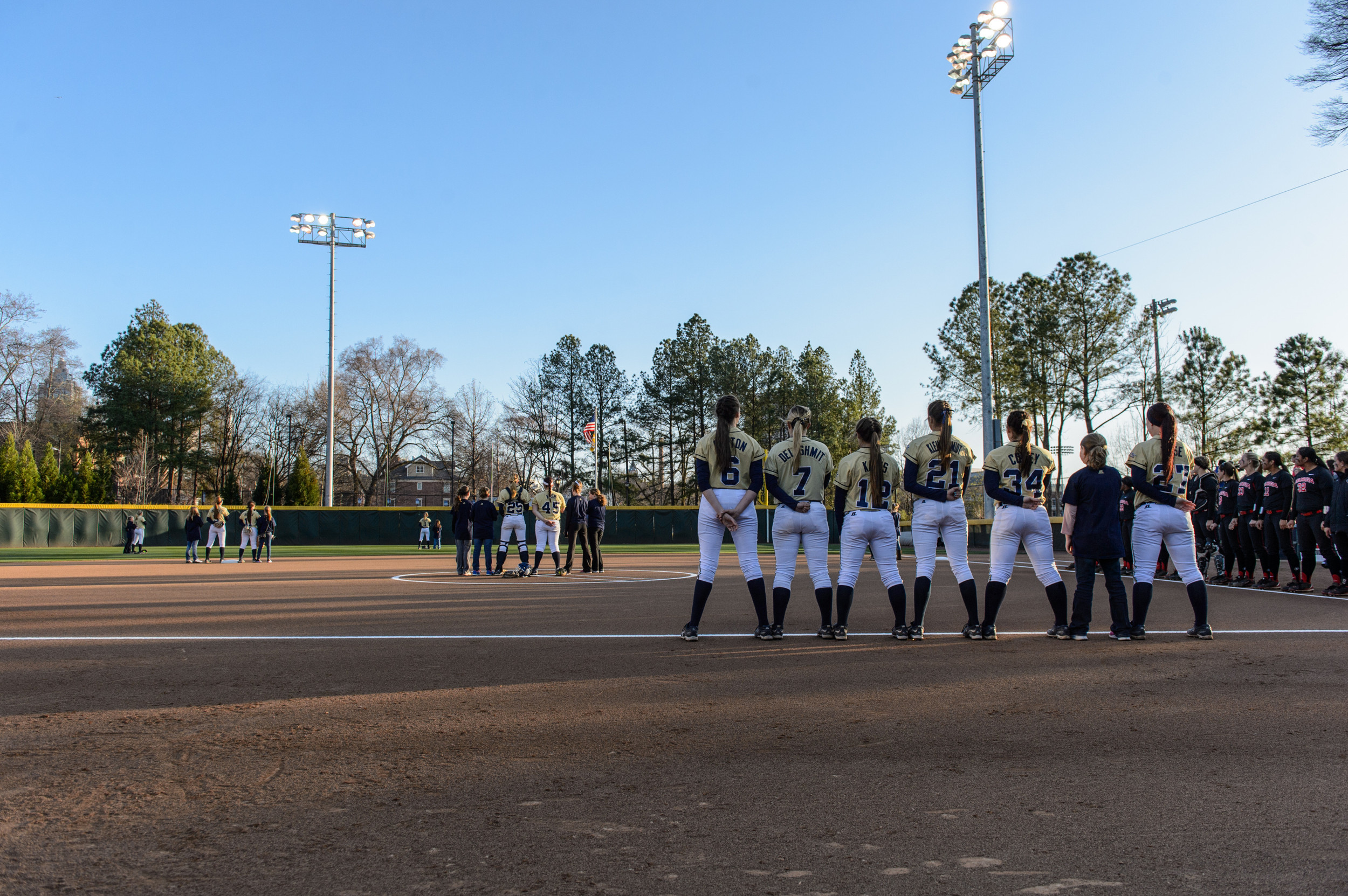 The teams line up during the National Anthem