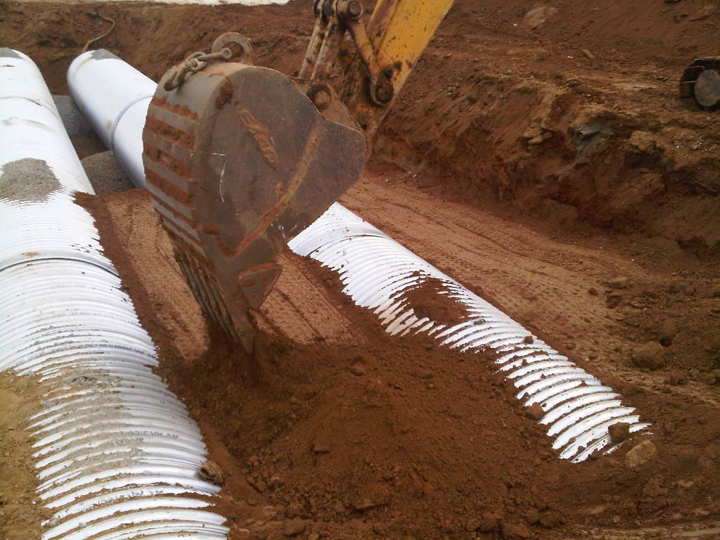 Photo taken on March 21, 2011 - Pipes going in under fields to hold excess water