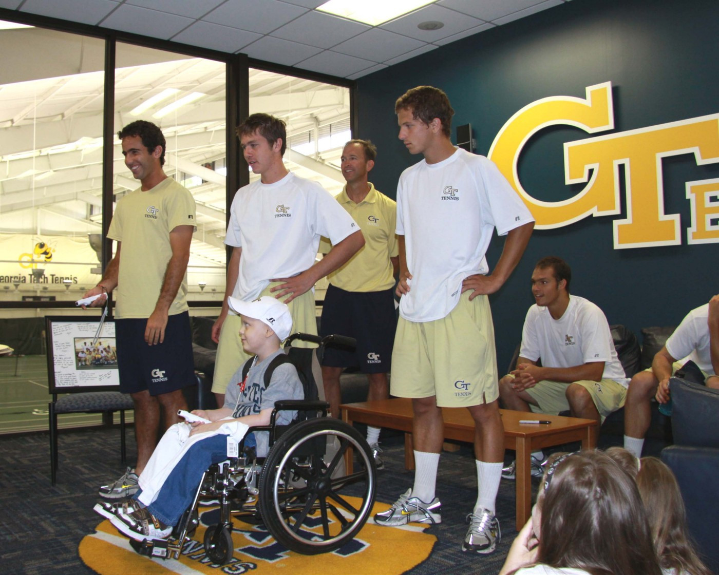 Magin Ortiga, Eliot Potvin and Dusan Miljevic get Nolan started on Wii Tennis.