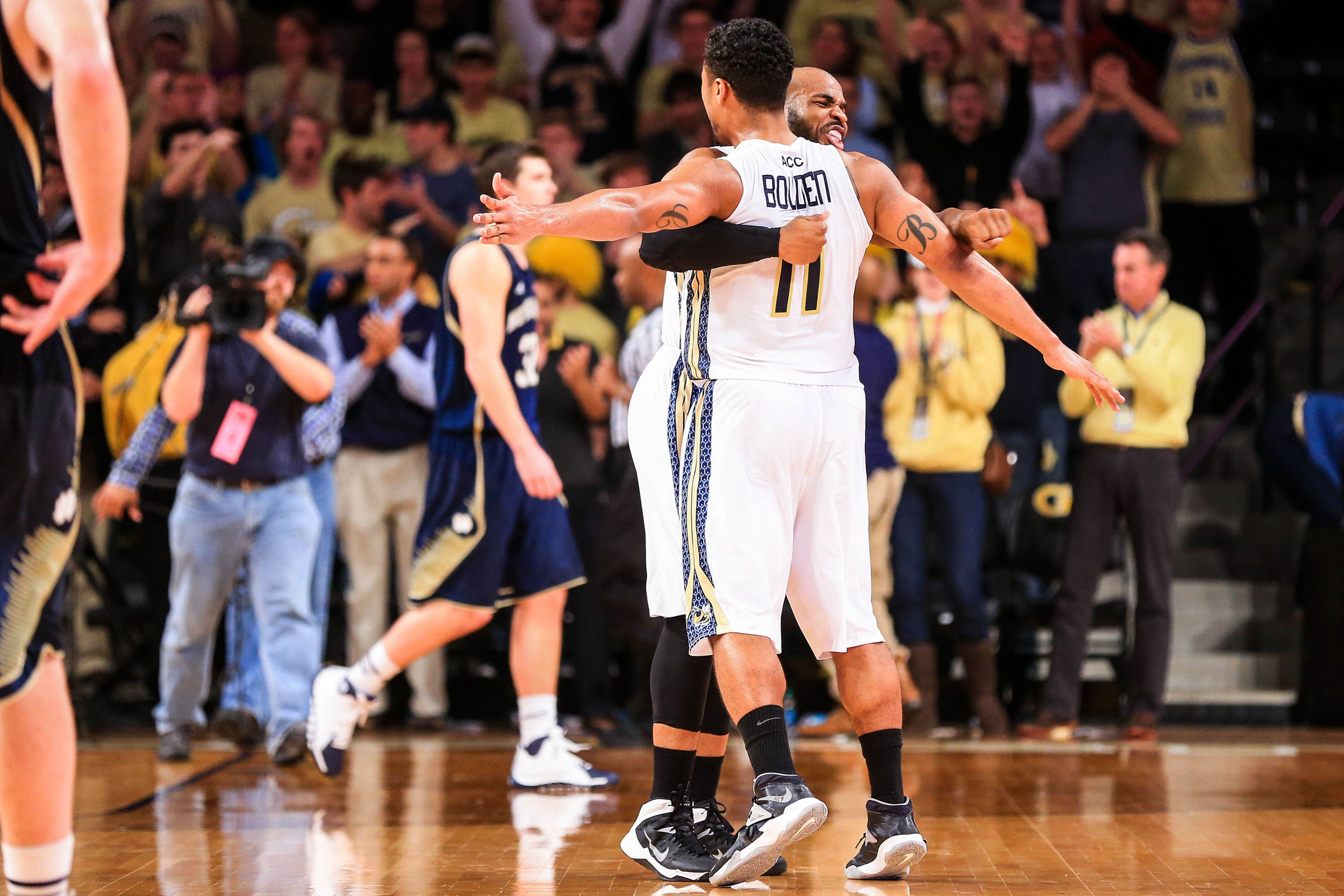 Jan 11, 2014; Atlanta, GA, USA; Georgia Tech Yellow Jackets guard Chris Bolden (11) and guard Trae Golden (23) celebrate beating in the Notre Dame Fighting Irish at Hank McCamish Pavilion. Georgia Tech won 74-69. Mandatory Credit: Daniel Shirey-USA TODAY Sports