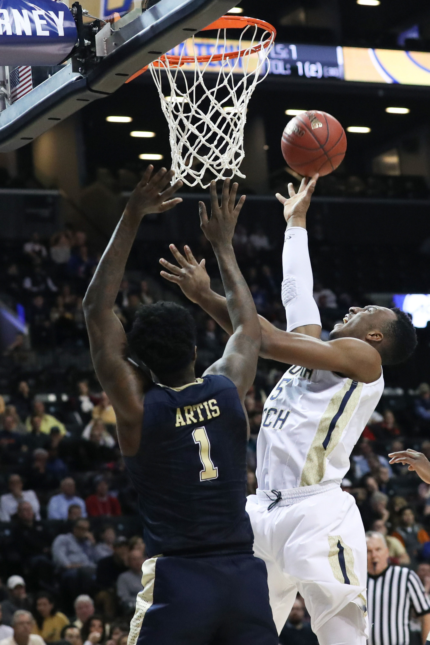 Guard Josh Okogie shoots over Pittsburgh Panthers forward Jamel Artis during the second half during the ACC Conference Tournament at Barclays Center. Credit: Anthony Gruppuso-USA TODAY Sports