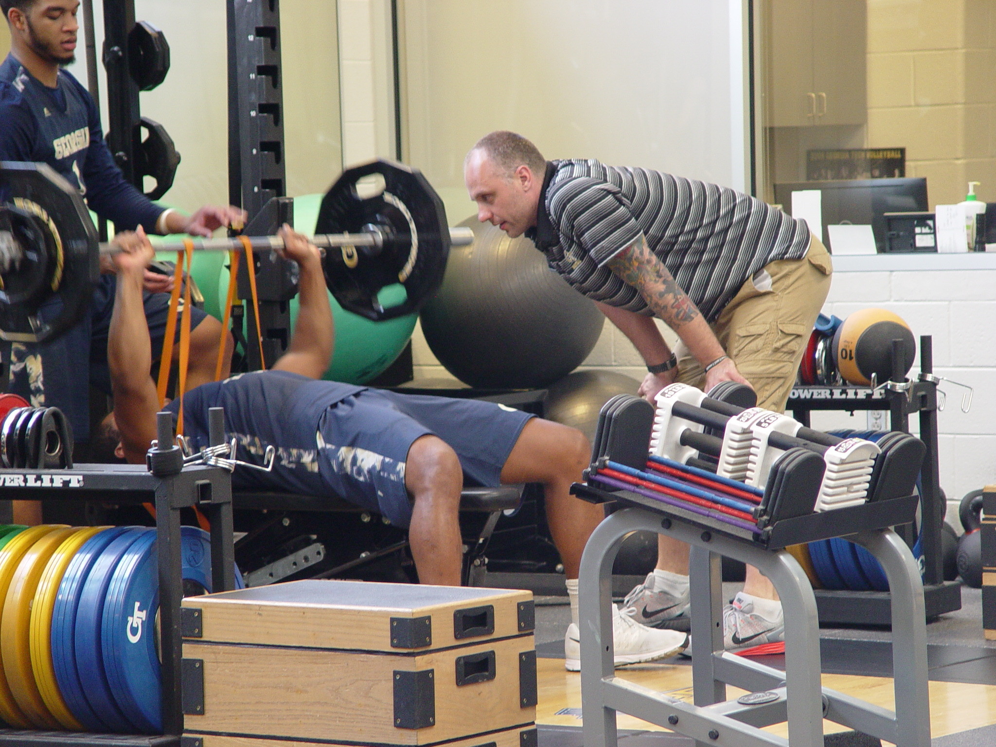 Player development coach Dan Taylor takes the Georgia Tech men's basketball team through a workout on June 16, 2016 in the Zelnak Center weight room.