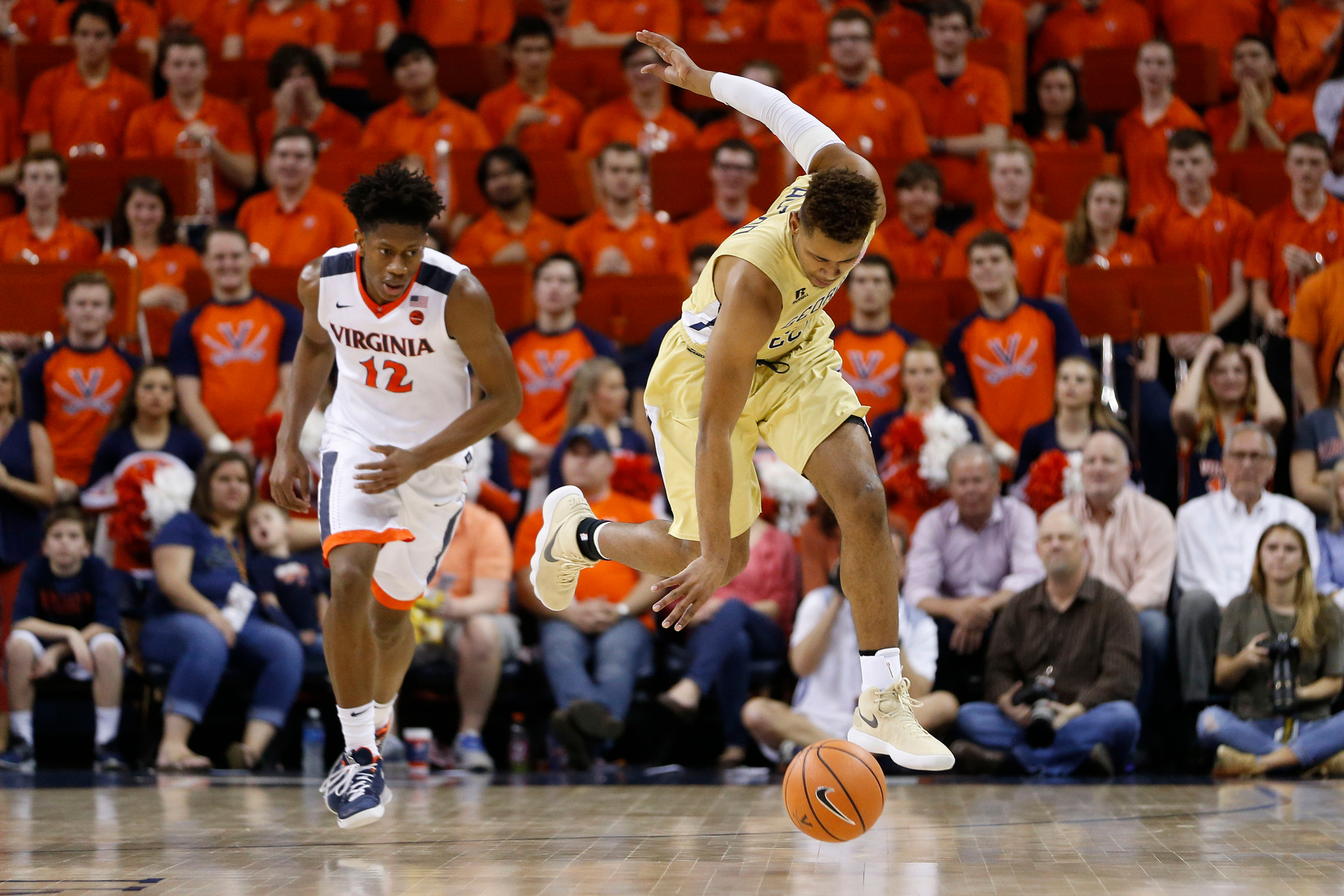 Feb 21, 2018; Charlottesville, VA, USA; Georgia Tech Yellow Jackets guard Brandon Alston (4) attempts to gain control of a loose ball in front of Virginia Cavaliers guard De'Andre Hunter (12) during the first half at John Paul Jones Arena. Mandatory Credit: Amber Searls-USA TODAY Sports